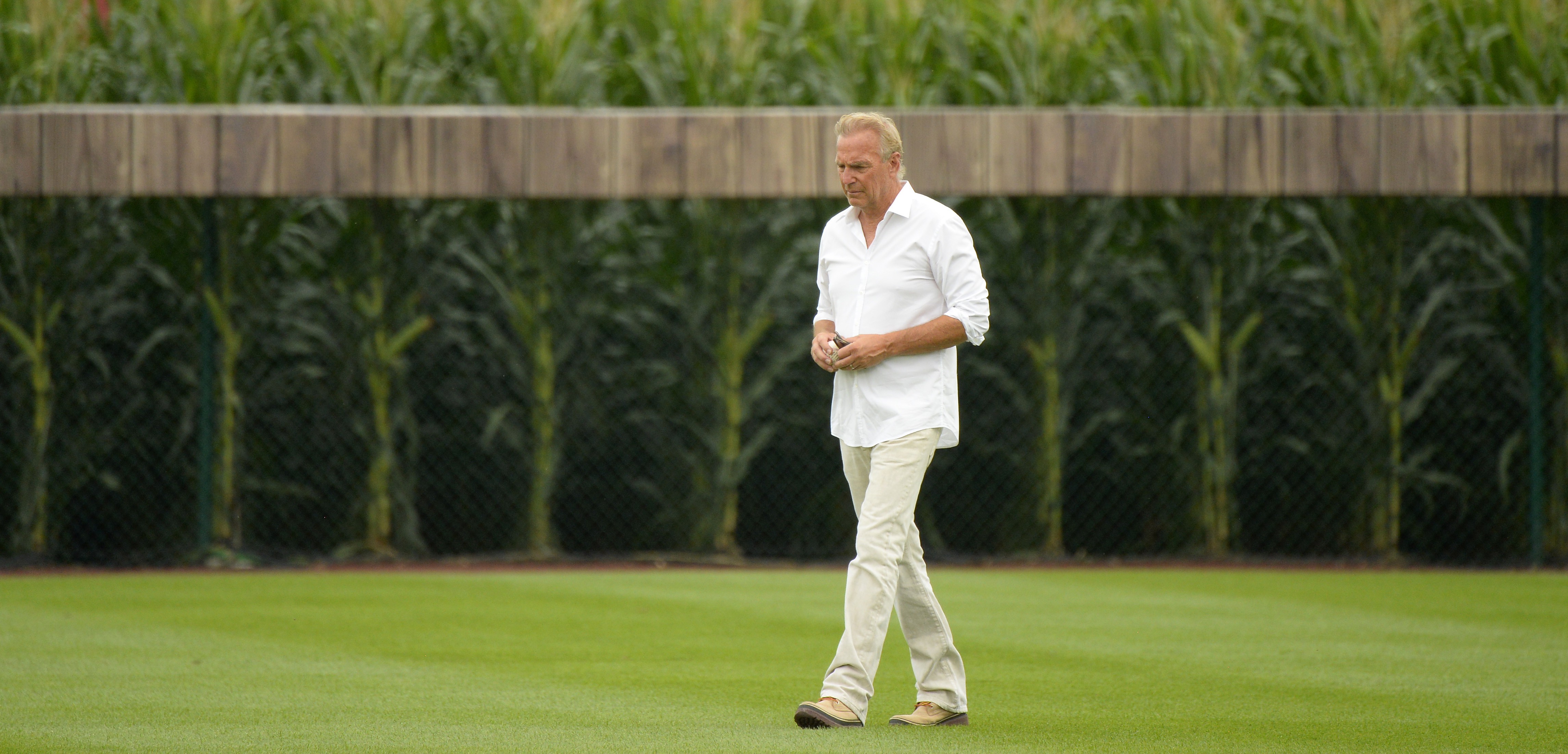 Kevin Costner walking in the outfield before the Chicago White Sox and New York Yankees game in 2021 | Source: Getty Images