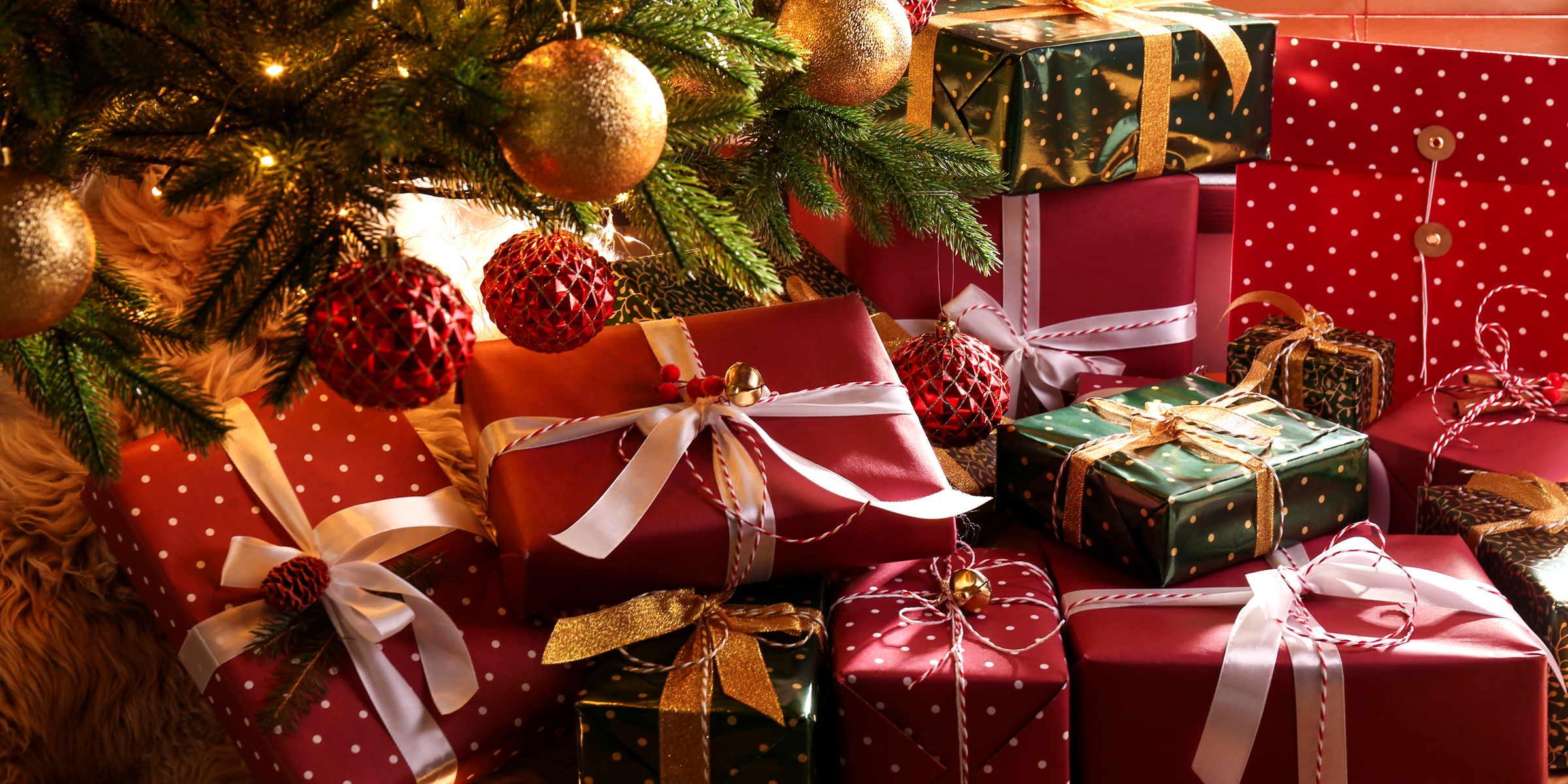 Christmas gifts under a tree | Source: Shutterstock