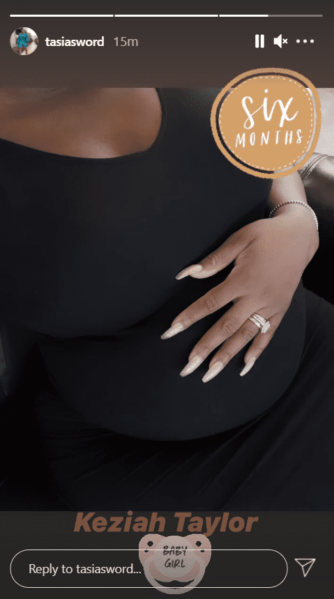 A picture of a pregnant Fantasia Barrino cradling her baby bump on Instagram | Photo: Instagram.com/tasiasword