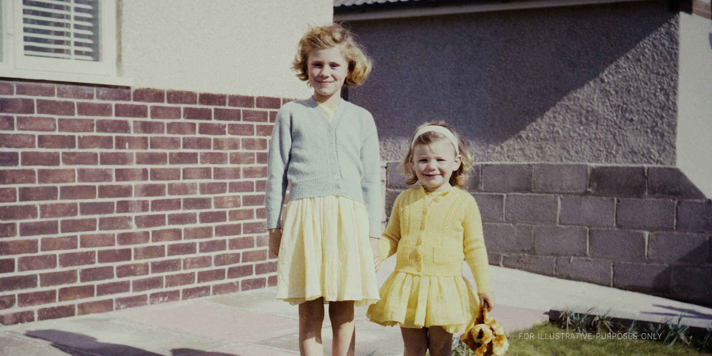 Two Girls Smiling While Posing For A Photo. | Source: Getty Images