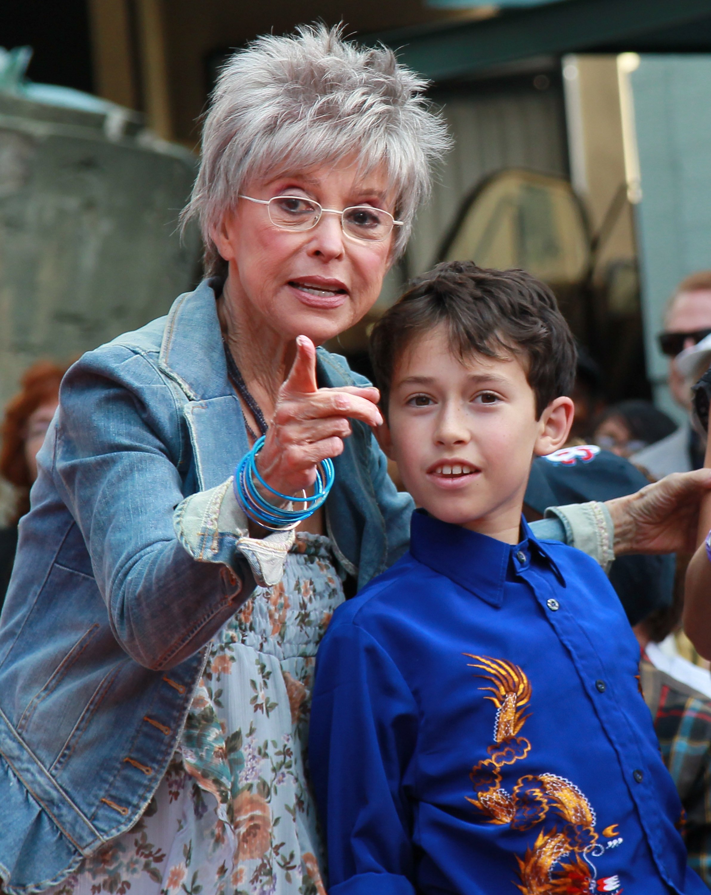 Rita Moreno and Cameron Fisher at the hand and footprint ceremony celebrating "West Side Story" at Grauman's Chinese Theatre in Hollywood, California, on November 15, 2011. | Source: Getty Images 