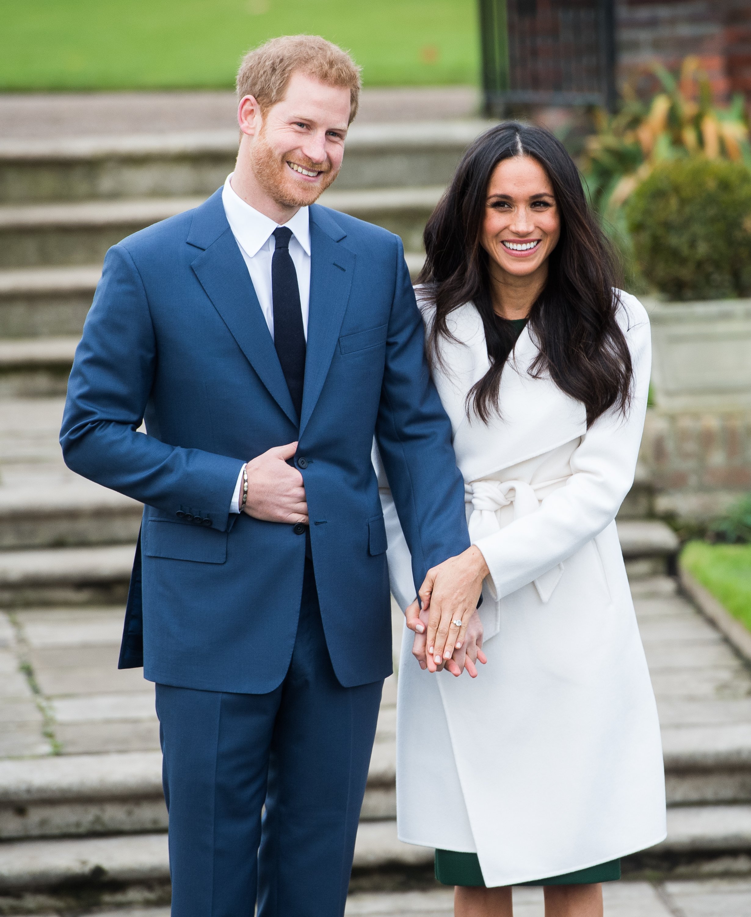 Prince Harry and Meghan Markle during an official photocall to announce their engagement at Kensington Palace on November 27, 2017, in London, England. | Source: Getty Images