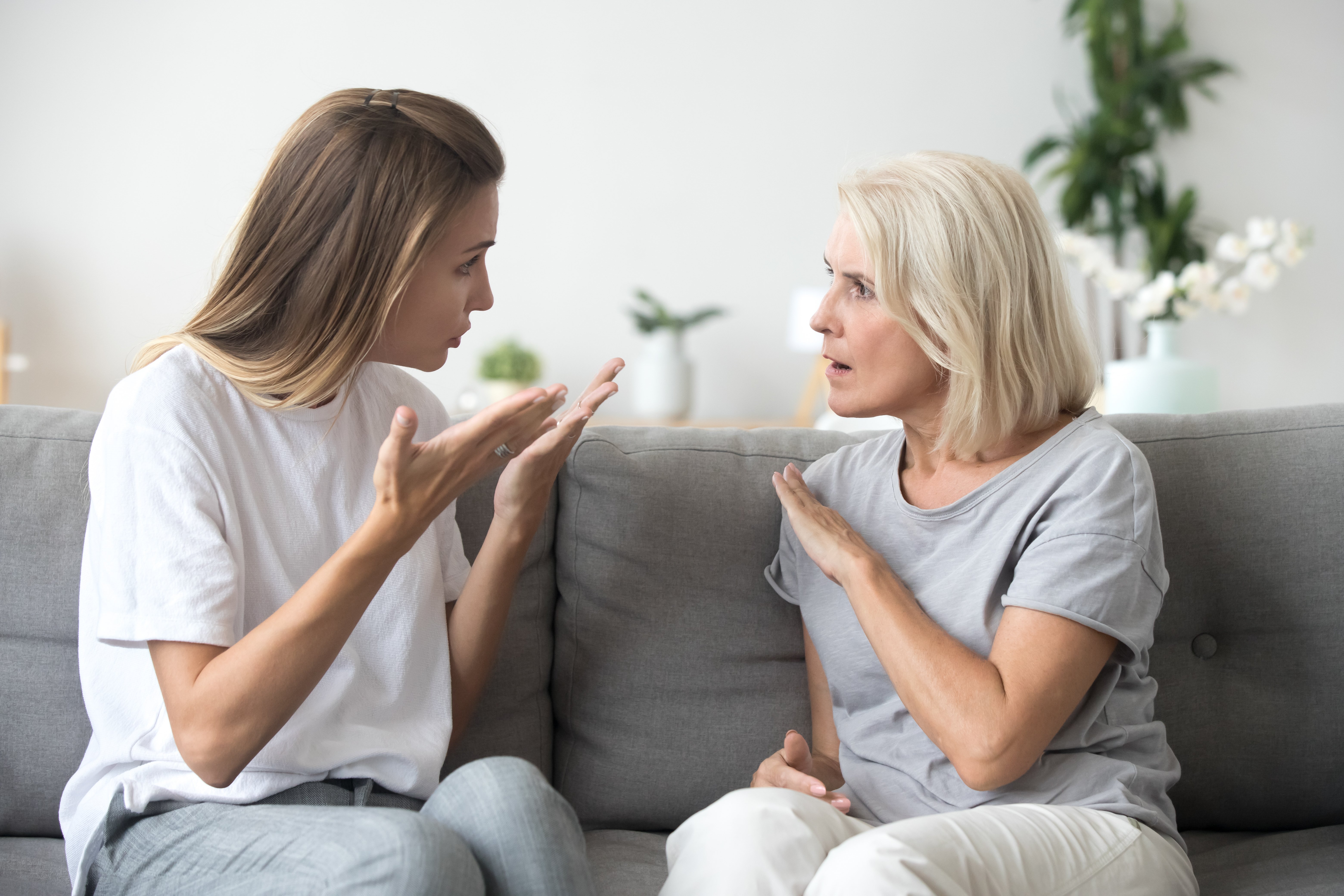 Angry young woman disagreeing with senior mom. | Source: Shutterstock