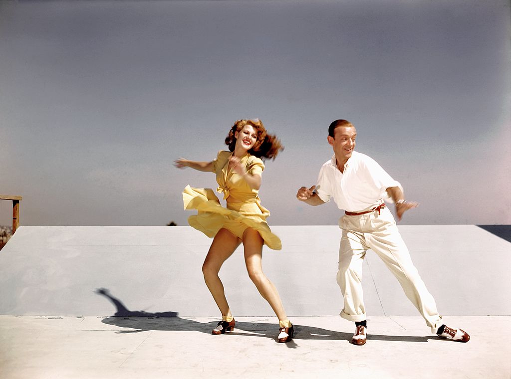  Rita Hayworth and Fred Astaire rehearse on a roof top at Columbia Pictures for a scene from their film 'You Were Never Lovelier' in 1942 in Los Angeles, California. | Source: Getty Images