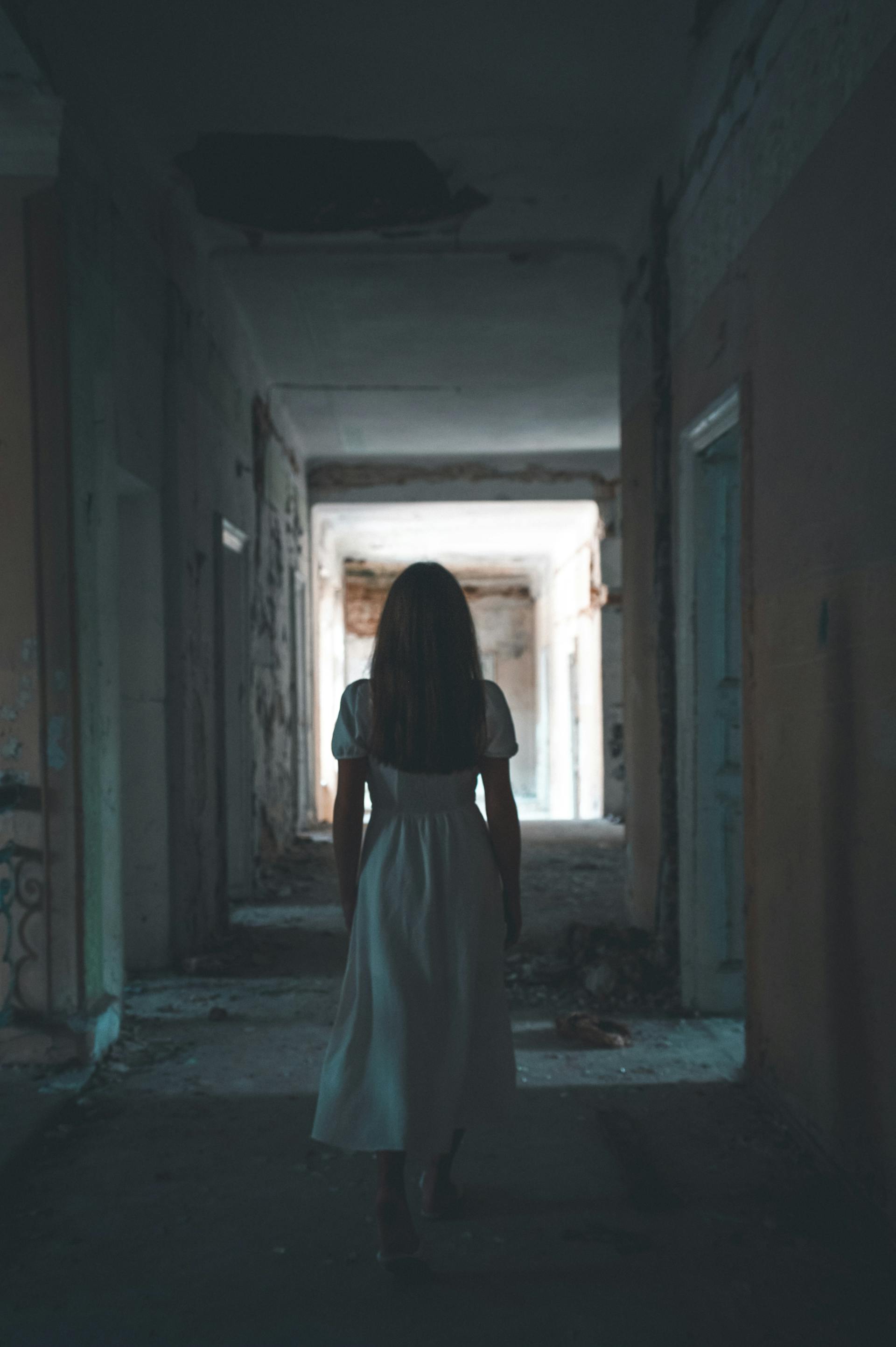 A young woman in an abandoned building | Source: Pexels