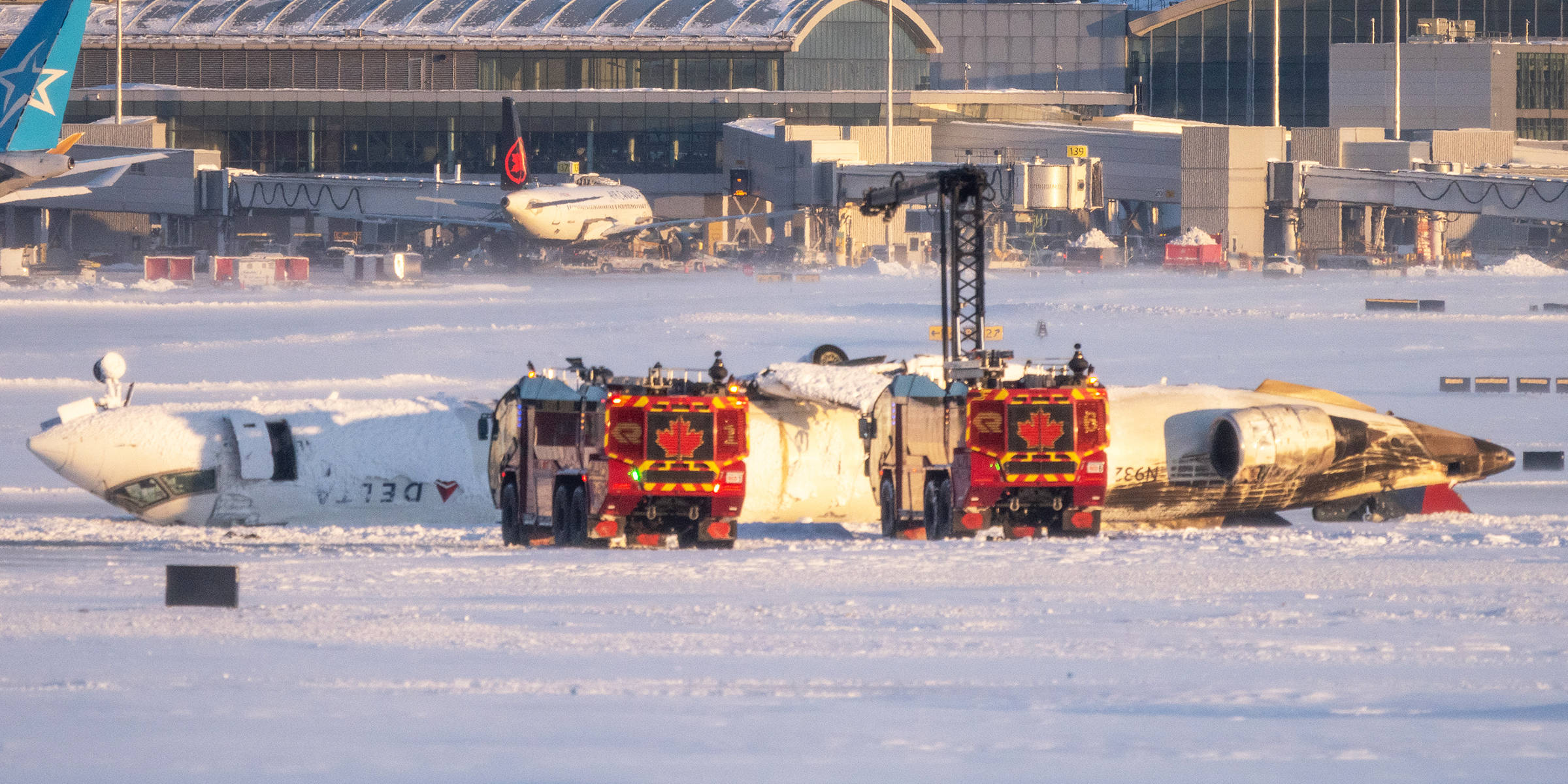 The crash site after the Delta plane crashed in Toronto. | Source: Getty Images