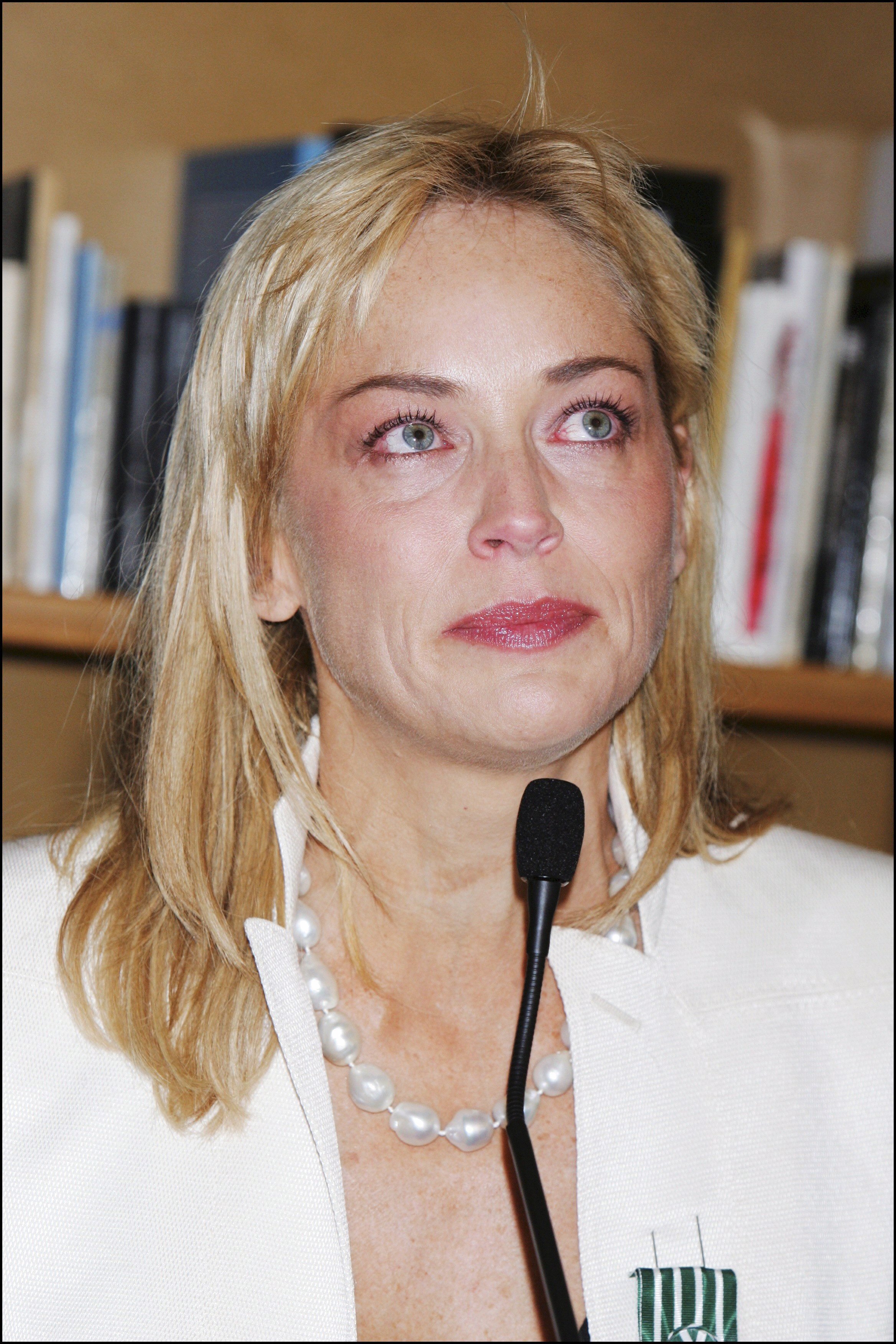 Sharon Stone awarded "Chevalier des arts et des lettres" by Gilles Jacob in Cannes, France on May 20, 2005. | Source: Pool BENAINOUS/CATARINA/LEGRAND/Gamma-Rapho/Getty Images