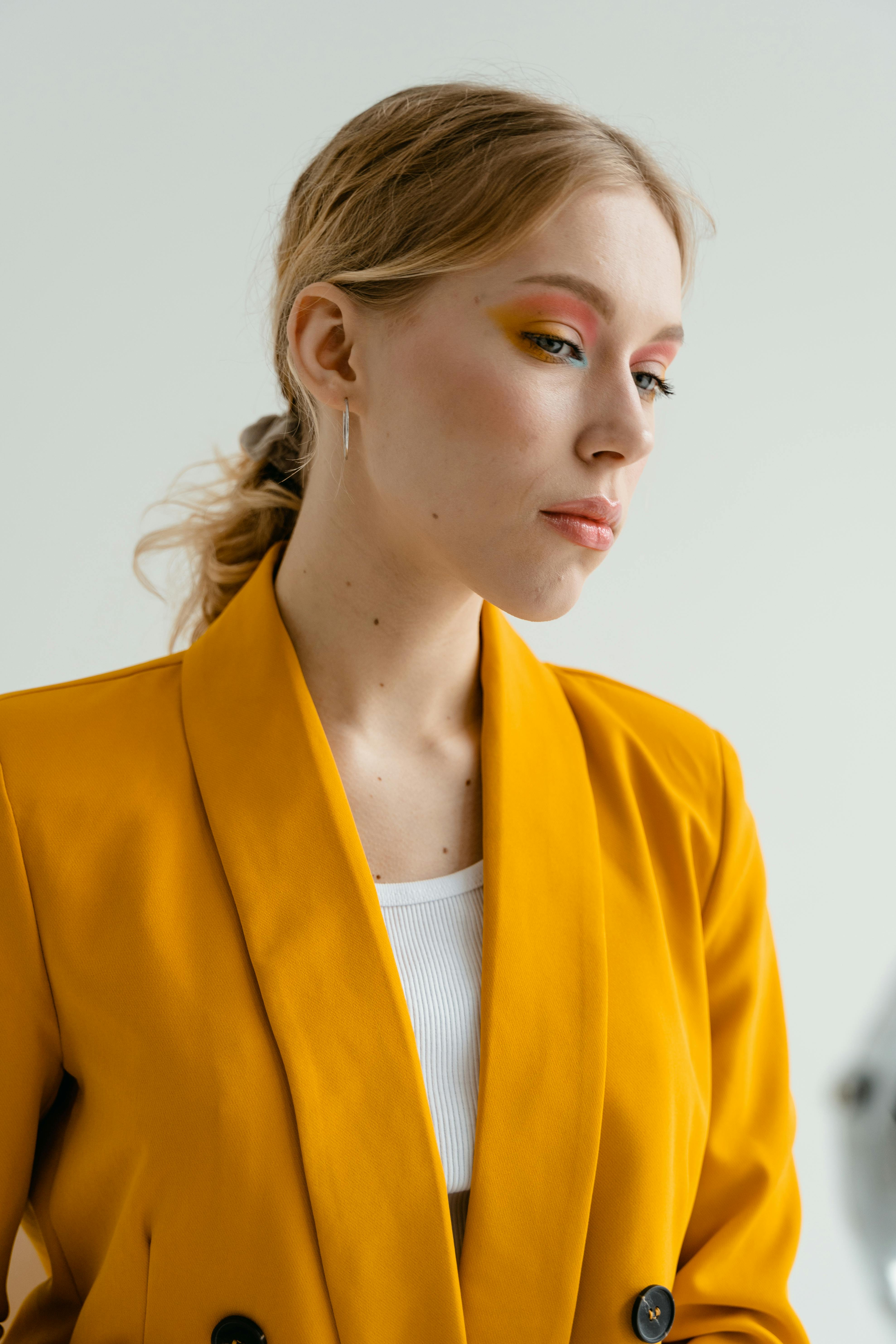 A woman in a bright yellow suit | Source: Pexels