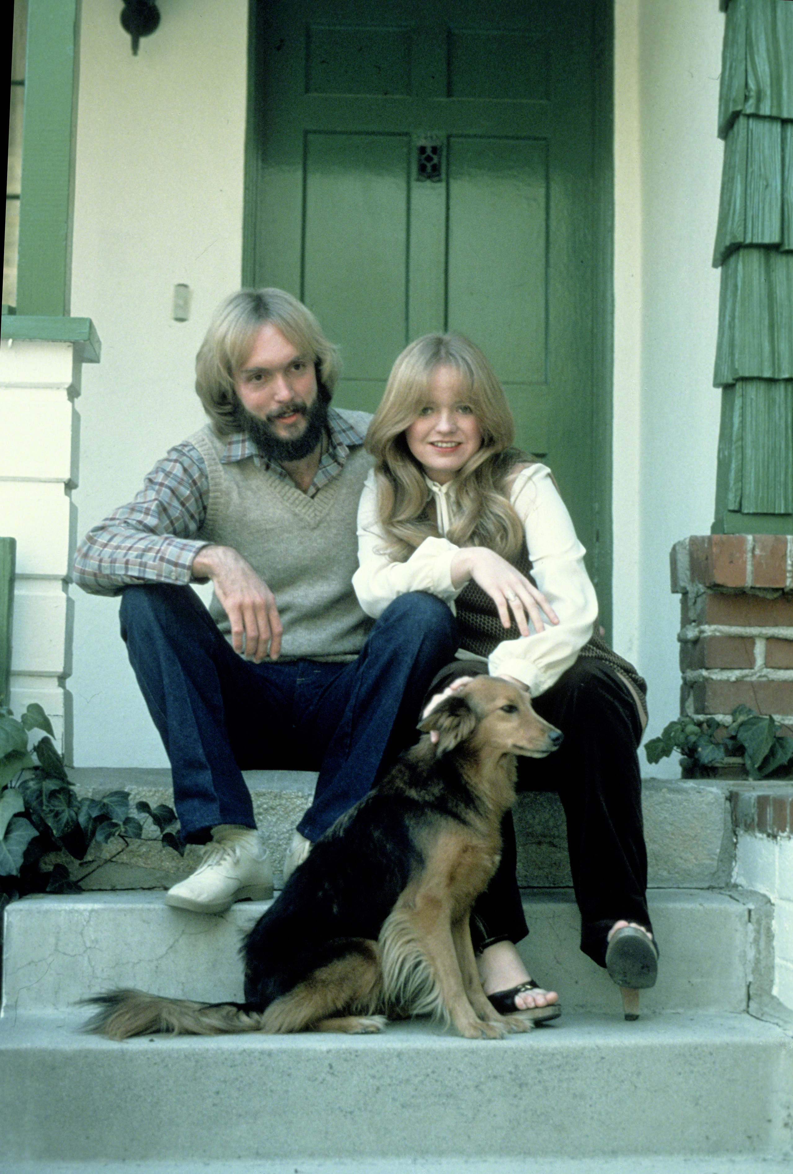 Michael Virden and Susan Richardson outside of their home with their pet dog in 1979 | Source: Getty Images