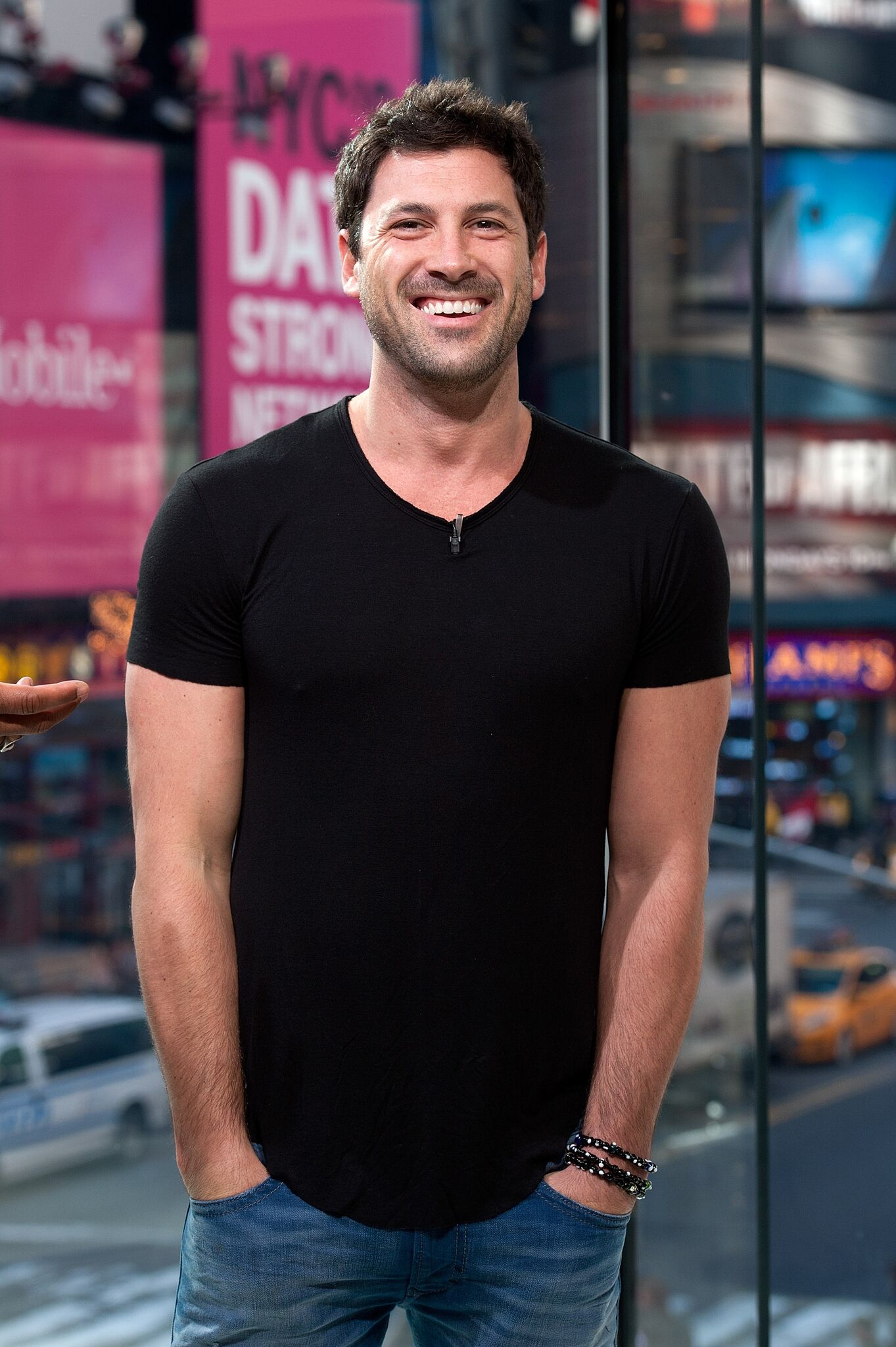 Maksim Chmerkovskiy visits "Extra" at their New York studios at H&M in Times Square  | Getty Images