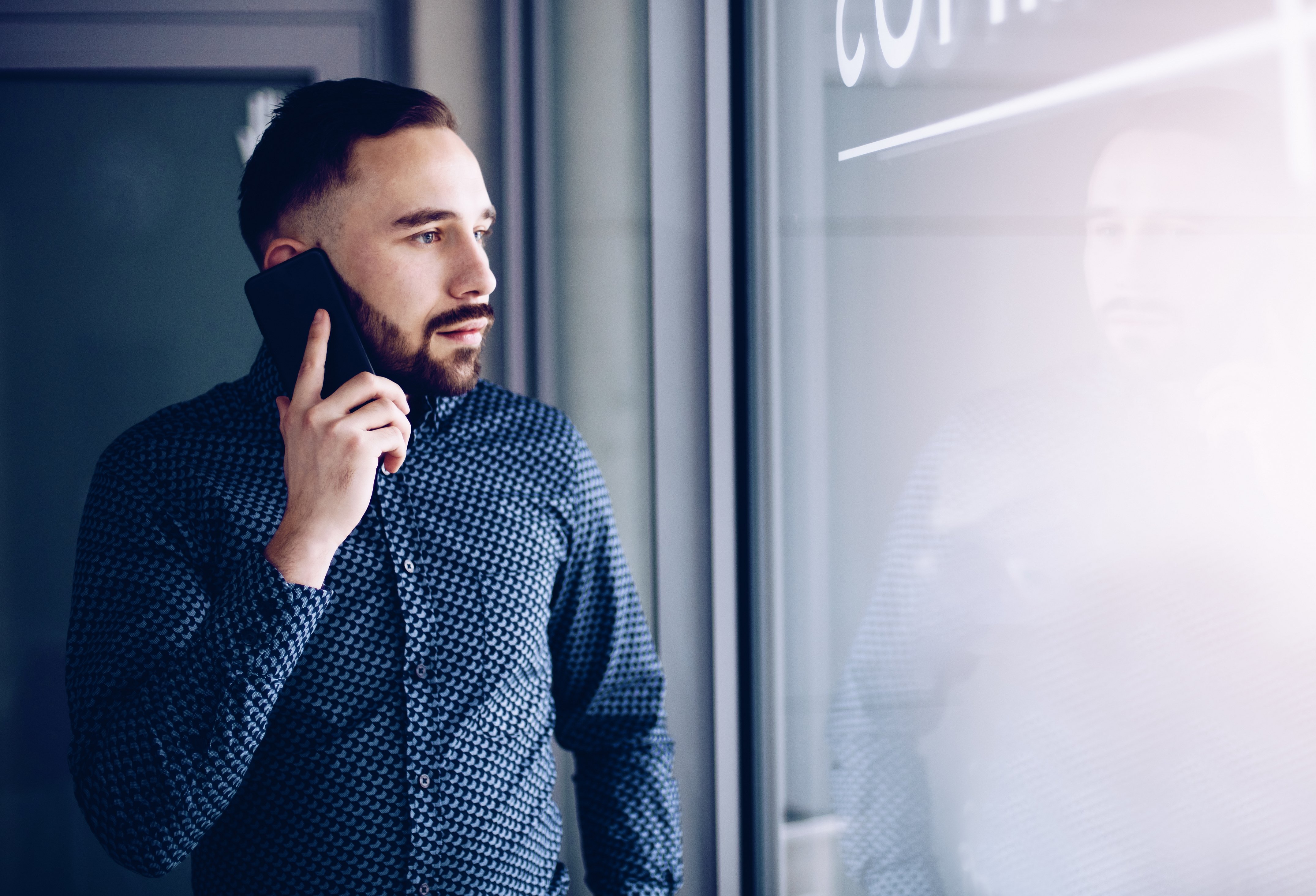 Man talking on a phone. Photo: Shutterstock