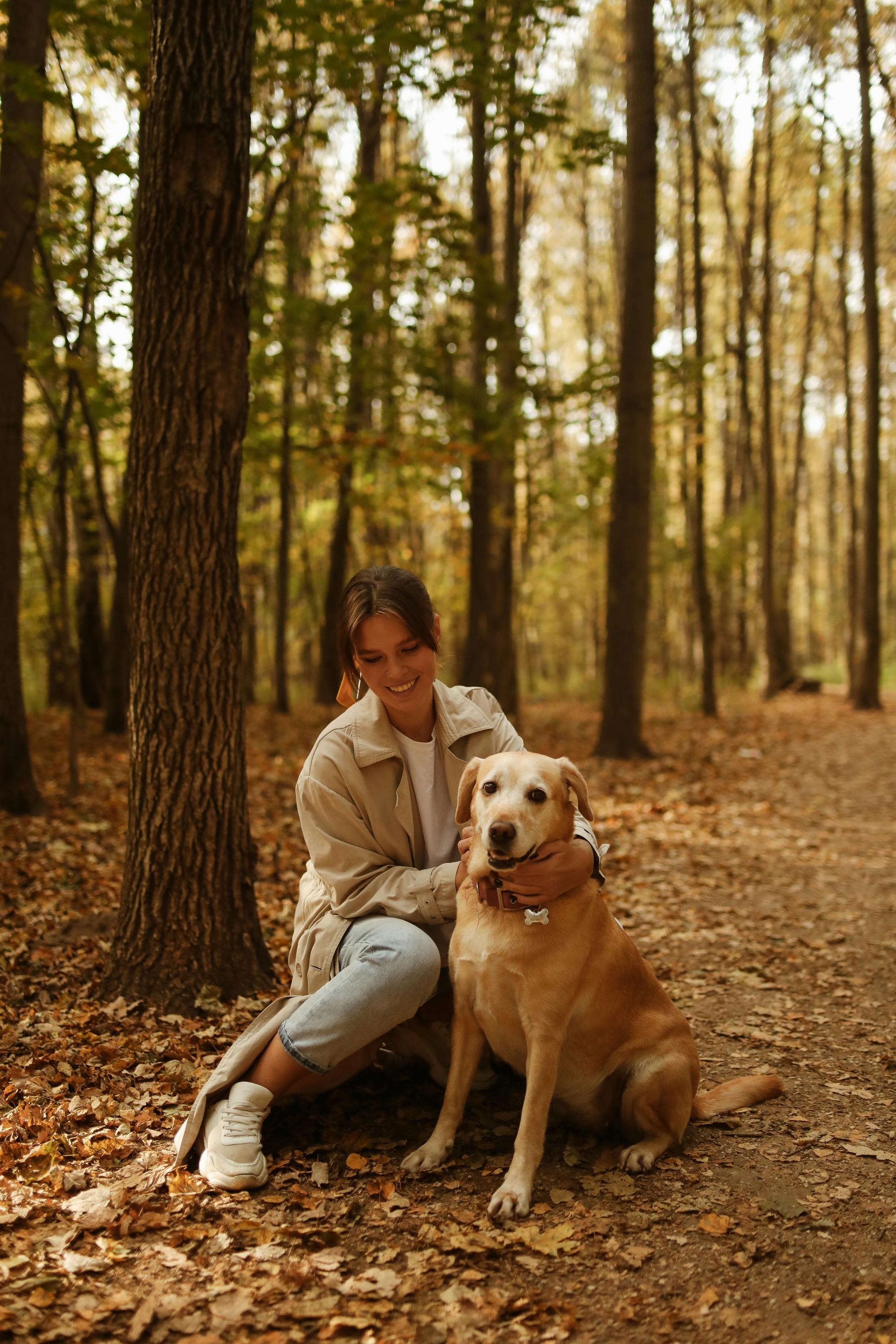 A smiling woman with her dog | Source: Pexels