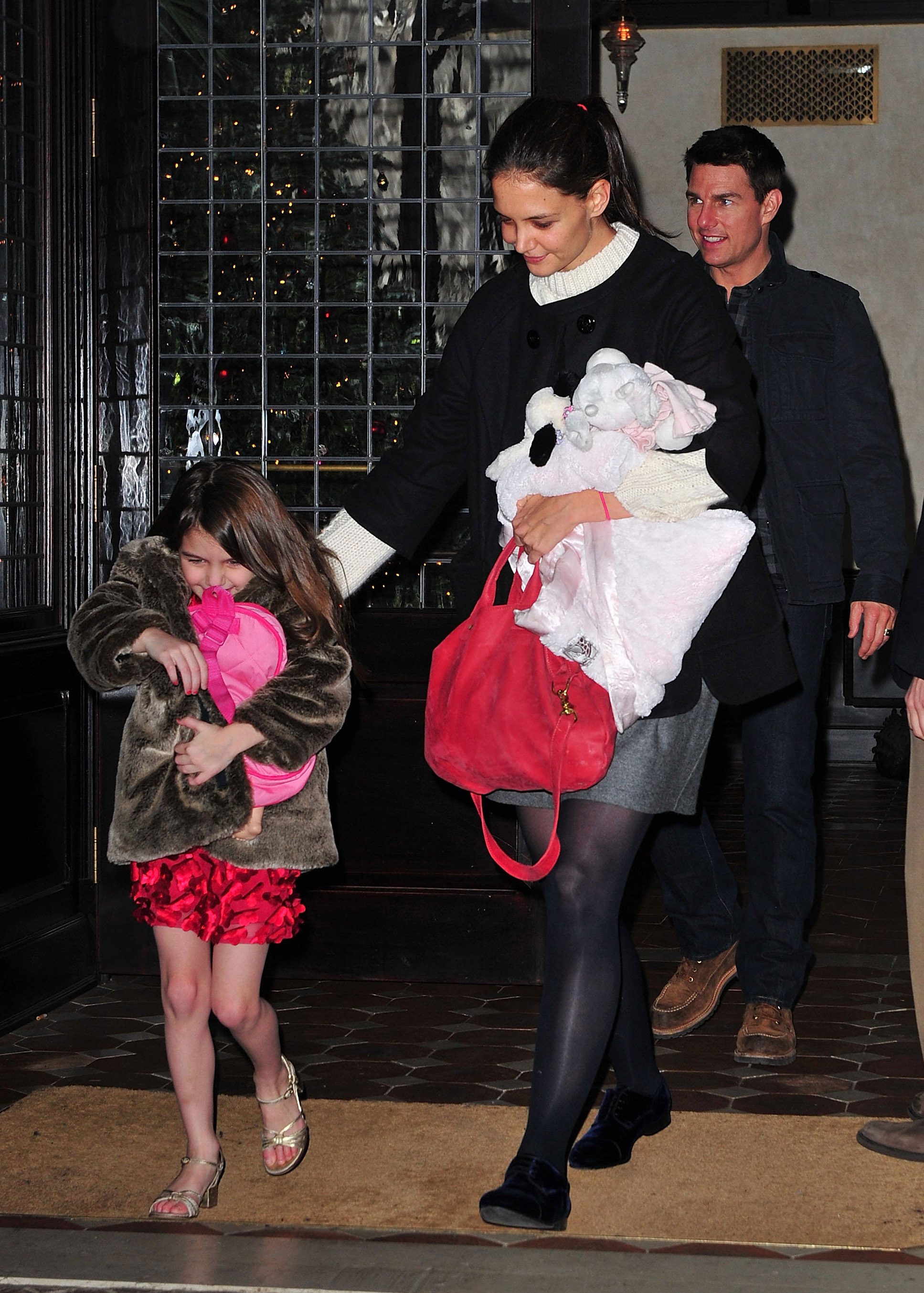 Suri Cruise, Katie Holmes, and Tom Cruise spotted in New York City on December 20, 2011 | Source: Getty Images