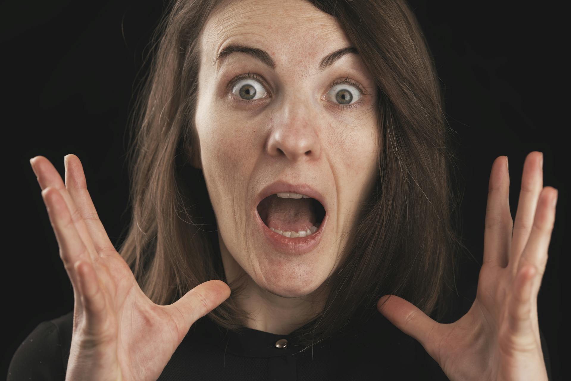 A middle-aged woman gaping in shock | Source: Pexels