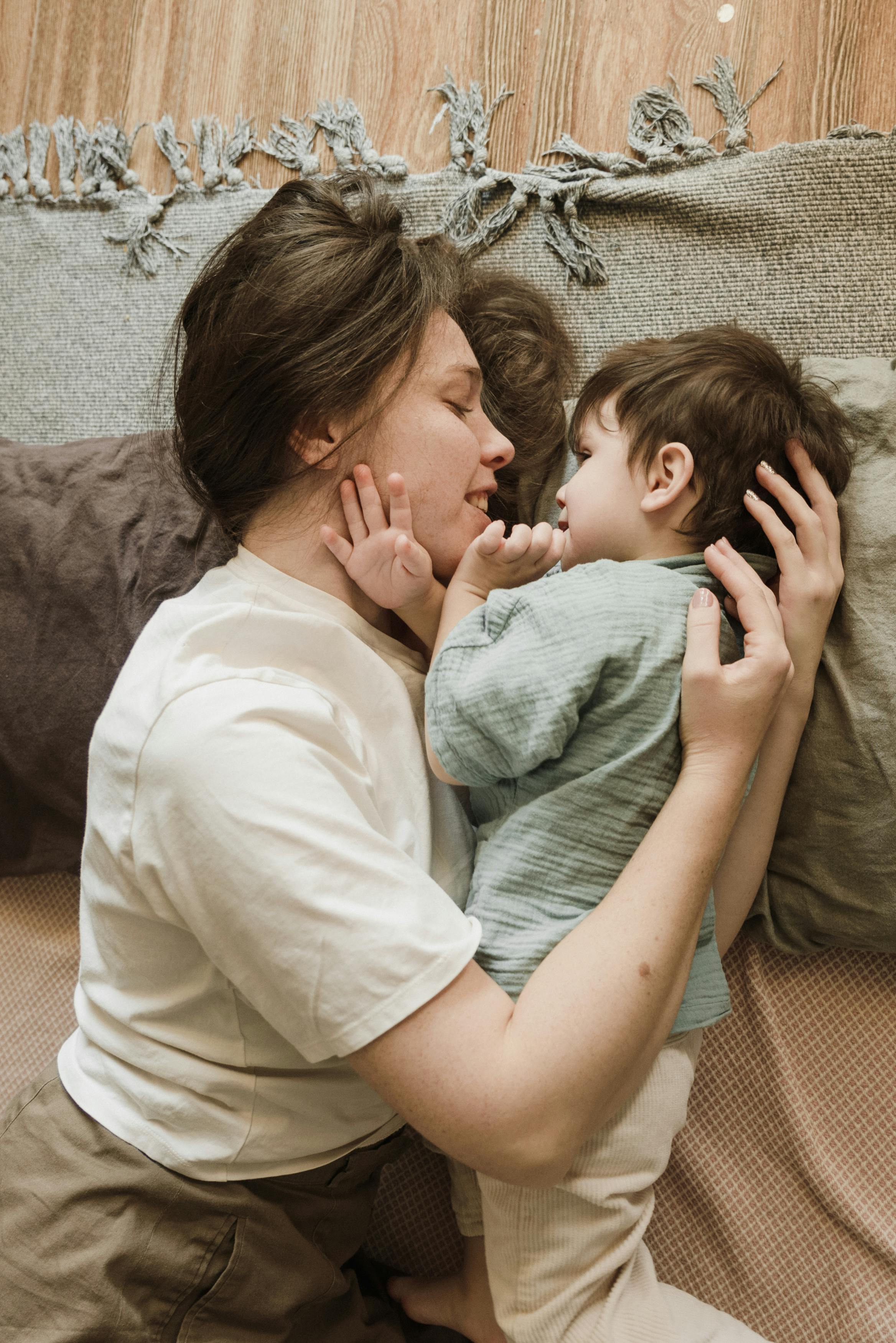 Woman holds her little son | Source: Pexels