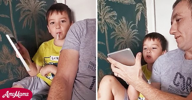 5-year-old Seany McEwan sitting with his father Andy as they both speak to virtual assistant Siri via an iPad. | Source: facebook.com/X Nicola Quinn