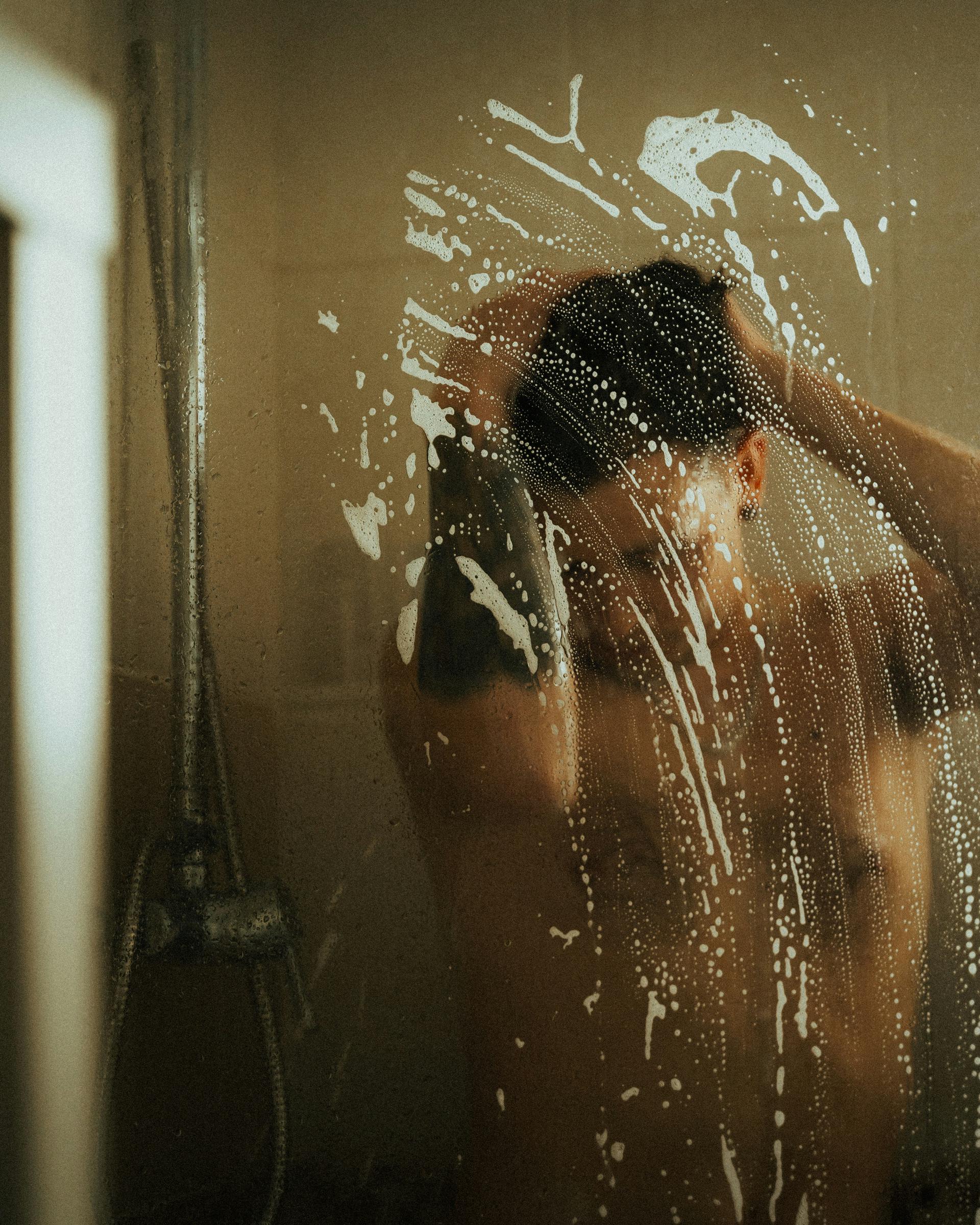 A man taking a shower | Source: Unsplash
