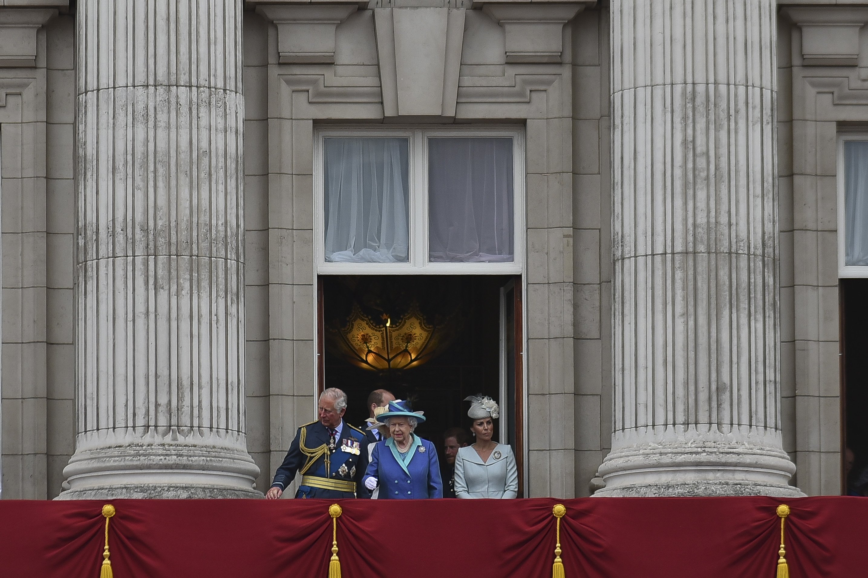 Queen Elizabeth II pictured arriving with other members of the Royal Family onto the balcony of Buckingham Palace to watch a military fly-past to mark the centenary of the Royal Air Force (RAF) on July 10, 2018 in London, England. / Source: Getty Images