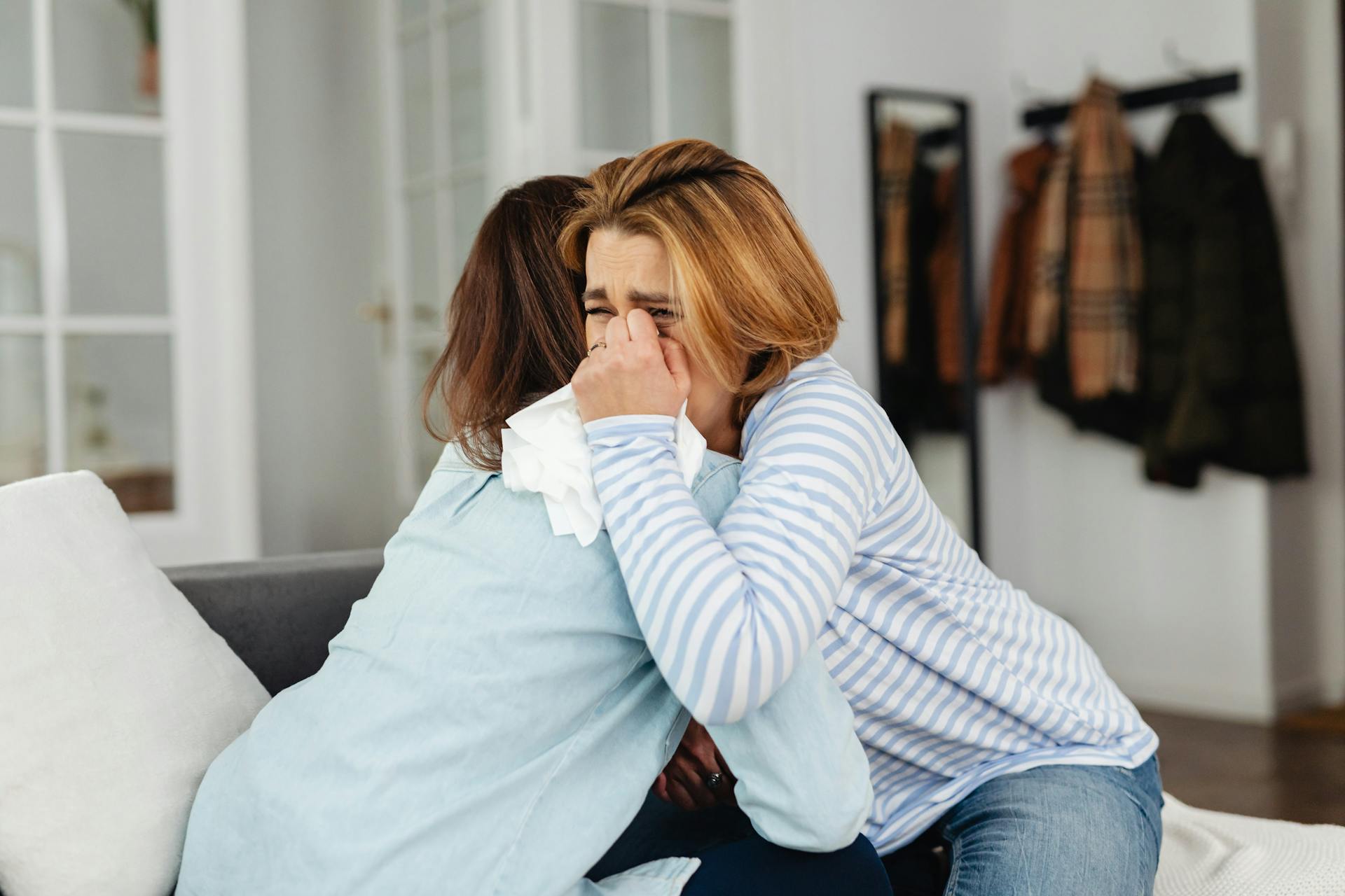 Two emotional women hugging each other | Source: Pexels