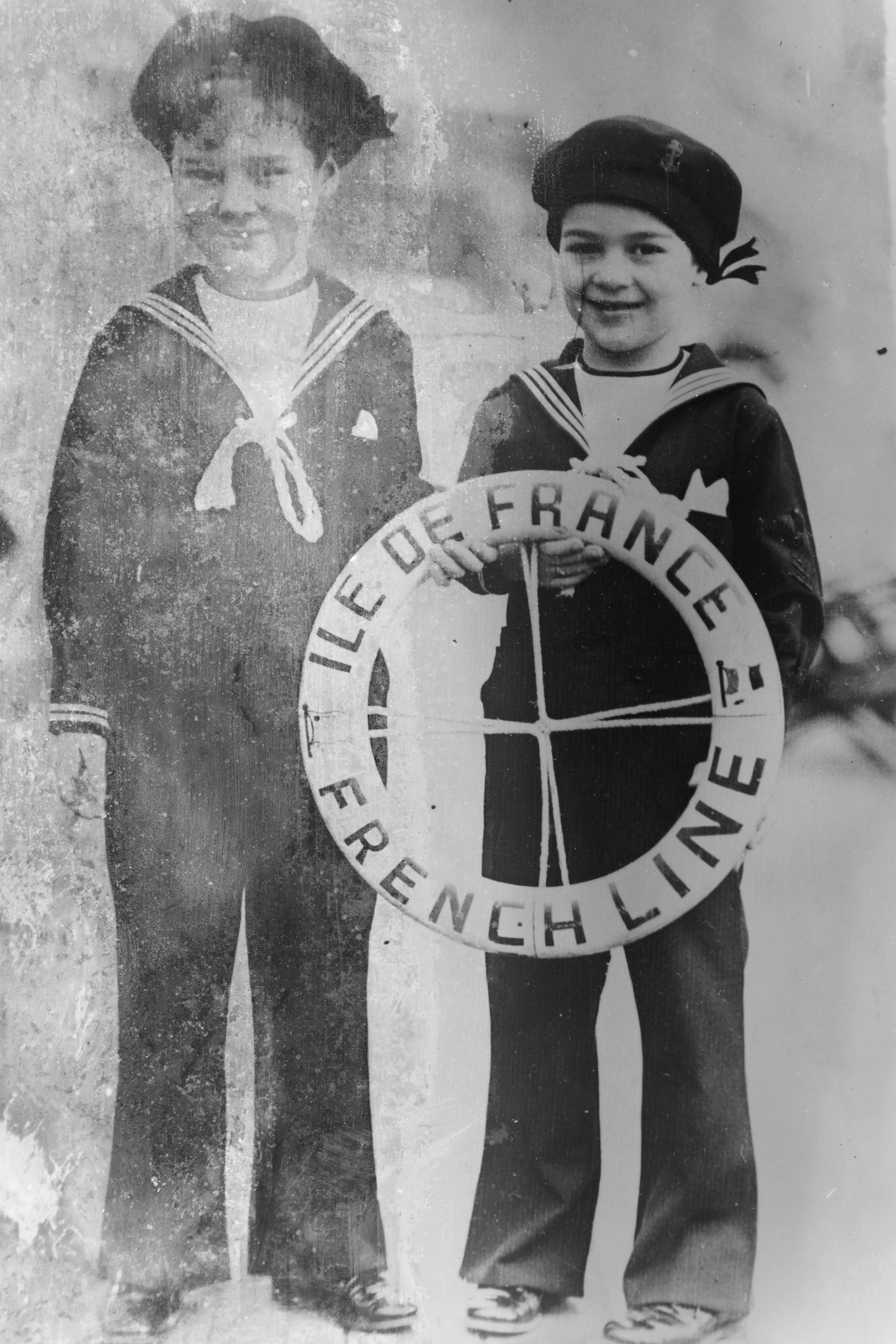 Sydney and Charles Chaplin Jr. were photographed aboard the ship "Ile de France" before their arrival at Le Havre on November 3, 1931 | Source: Getty Images