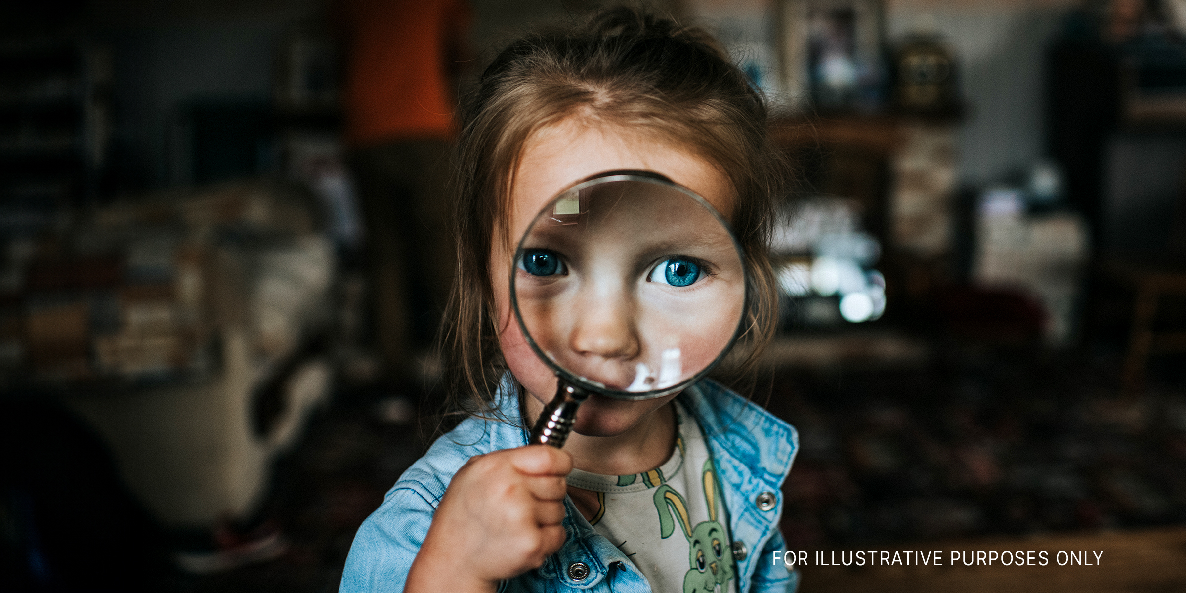 A little girl holding a microscope | Source: Shutterstock