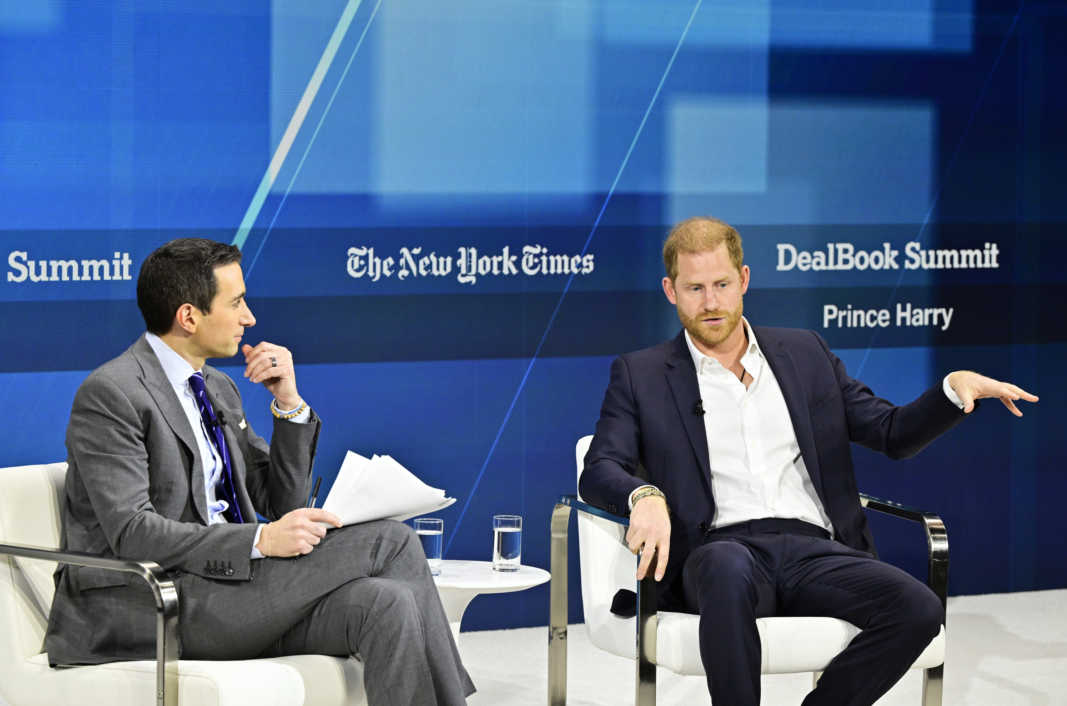 Andrew Ross Sorkin and Prince Harry conversing during The New York Times Dealbook Summit in New York City on December 4, 2024 | Source: Getty Images