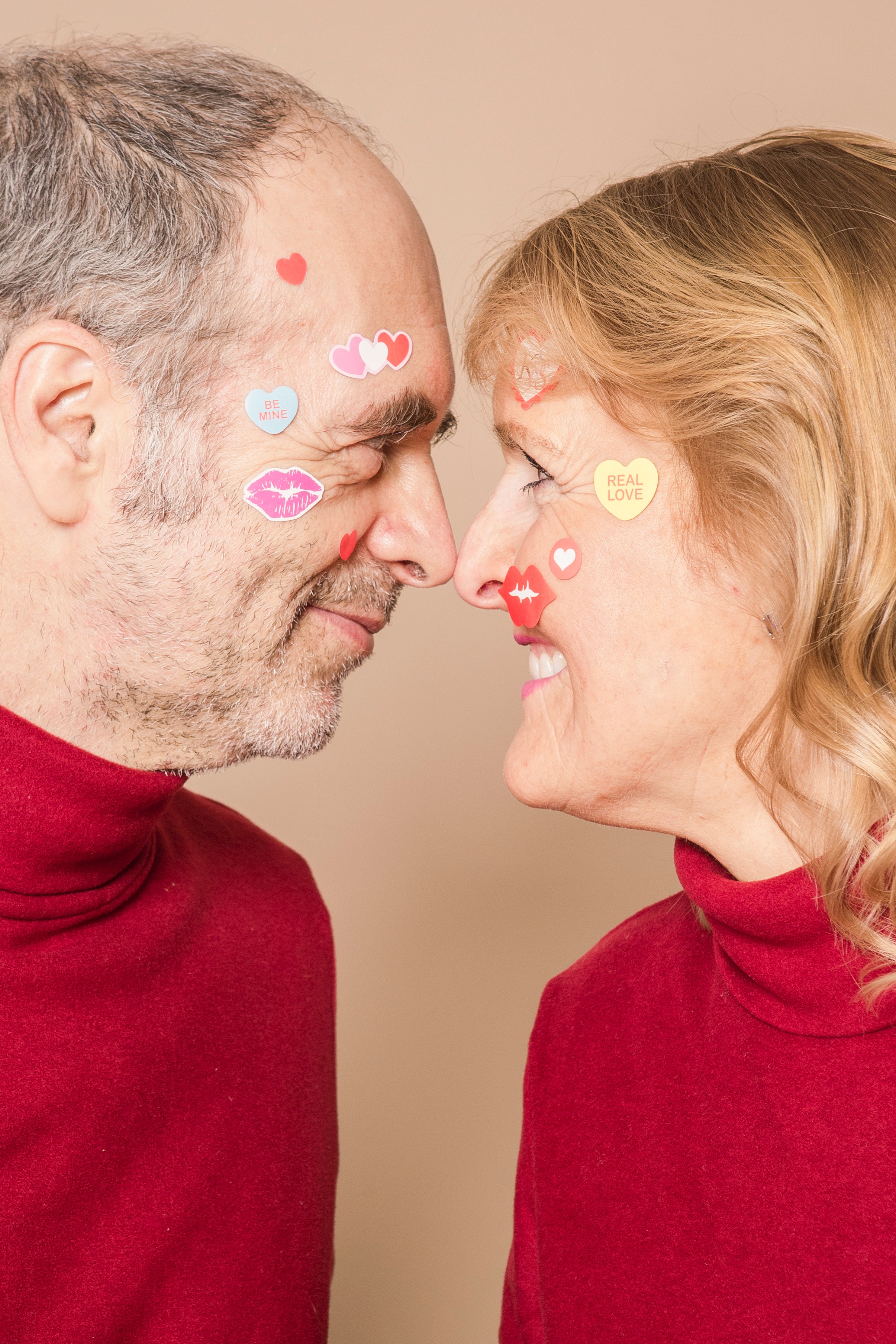 An elderly couple with stickers on their face. | Source: Pexels