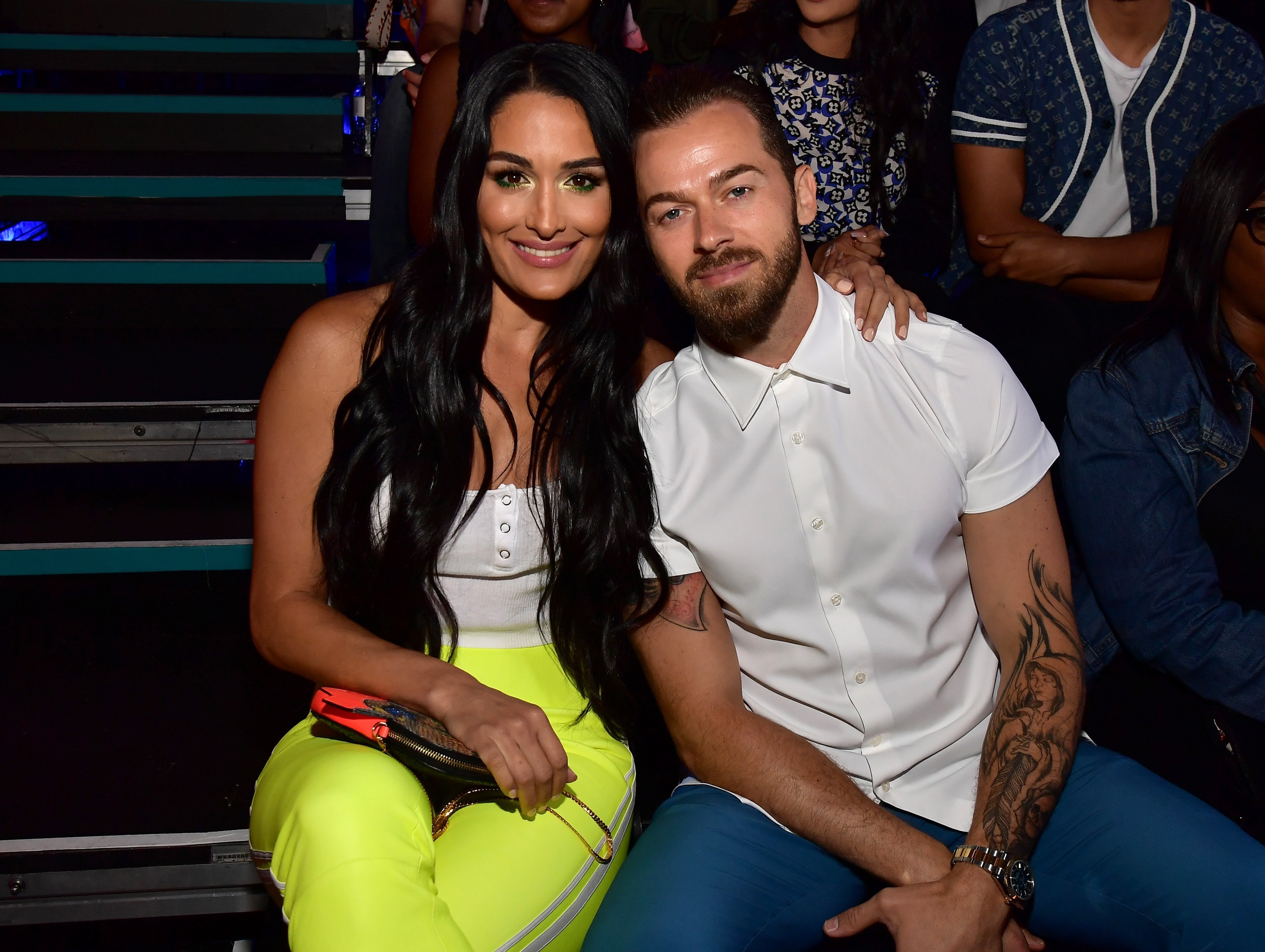 Nikki Bella and Artem Chigvintsev during Nickelodeon Kids' Choice Sports 2019 at Barker Hangar | Source: Getty Images