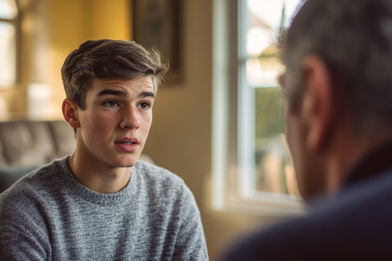 A boy talking to his father | Source: Midjourney