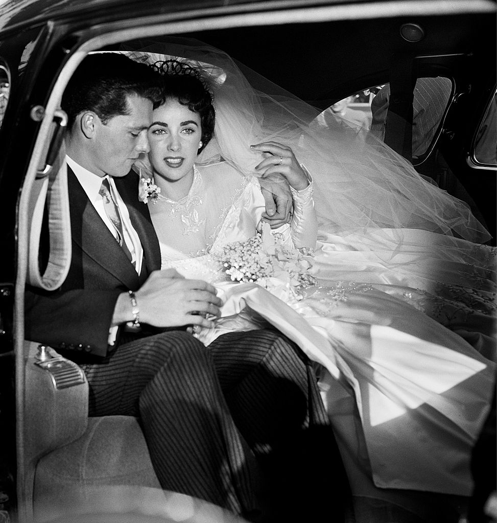  Elizabeth Taylor and hotel heir Conrad 'Nicky' Hilton sit in a limousine on their wedding day  | Getty Images