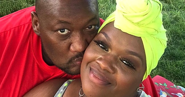 Troy Green kissing his wife Charletta Green on the cheek while she smiles. | Source: gofundme.com