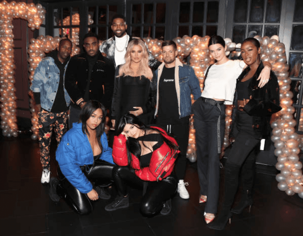 Rich Paul, Simon, Tristan Thompson, Khloe Kardashian, Lucas Newton, Kendall Jenner, Justine Skye, Jordan Woods and Kylie Jenner pose for Tristan Thompson's birthday hosted by Remy Martin, on March 10, 2018 in Los Angeles, California | Source: Jerritt Clark/Getty Images for Remy Martin.