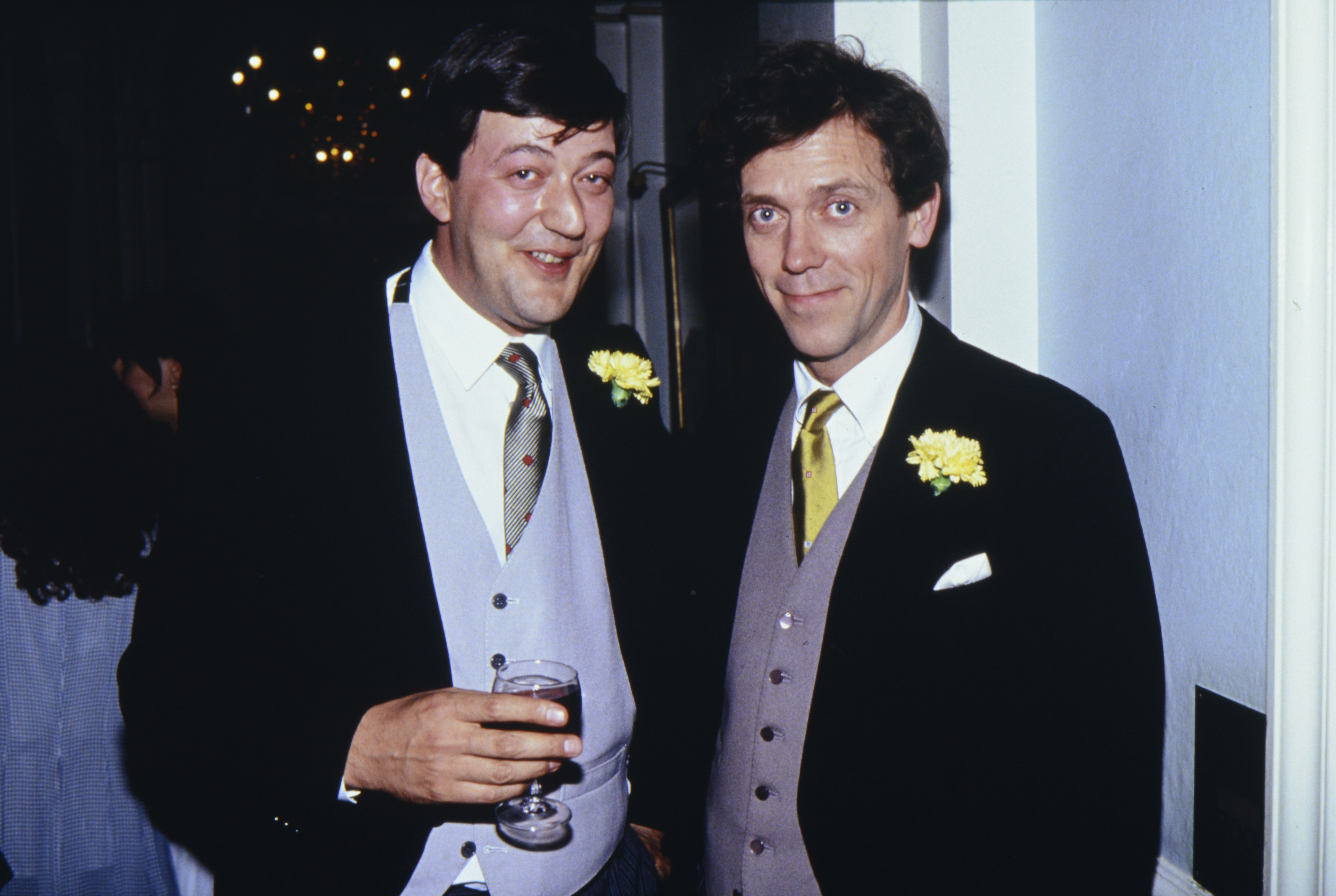 Stephen Fry and Hugh Laurie attend the UK premiere of "Four Weddings and A Funeral" in Leicester Square on May 11, 1994 in London, England. | Source: Getty Images