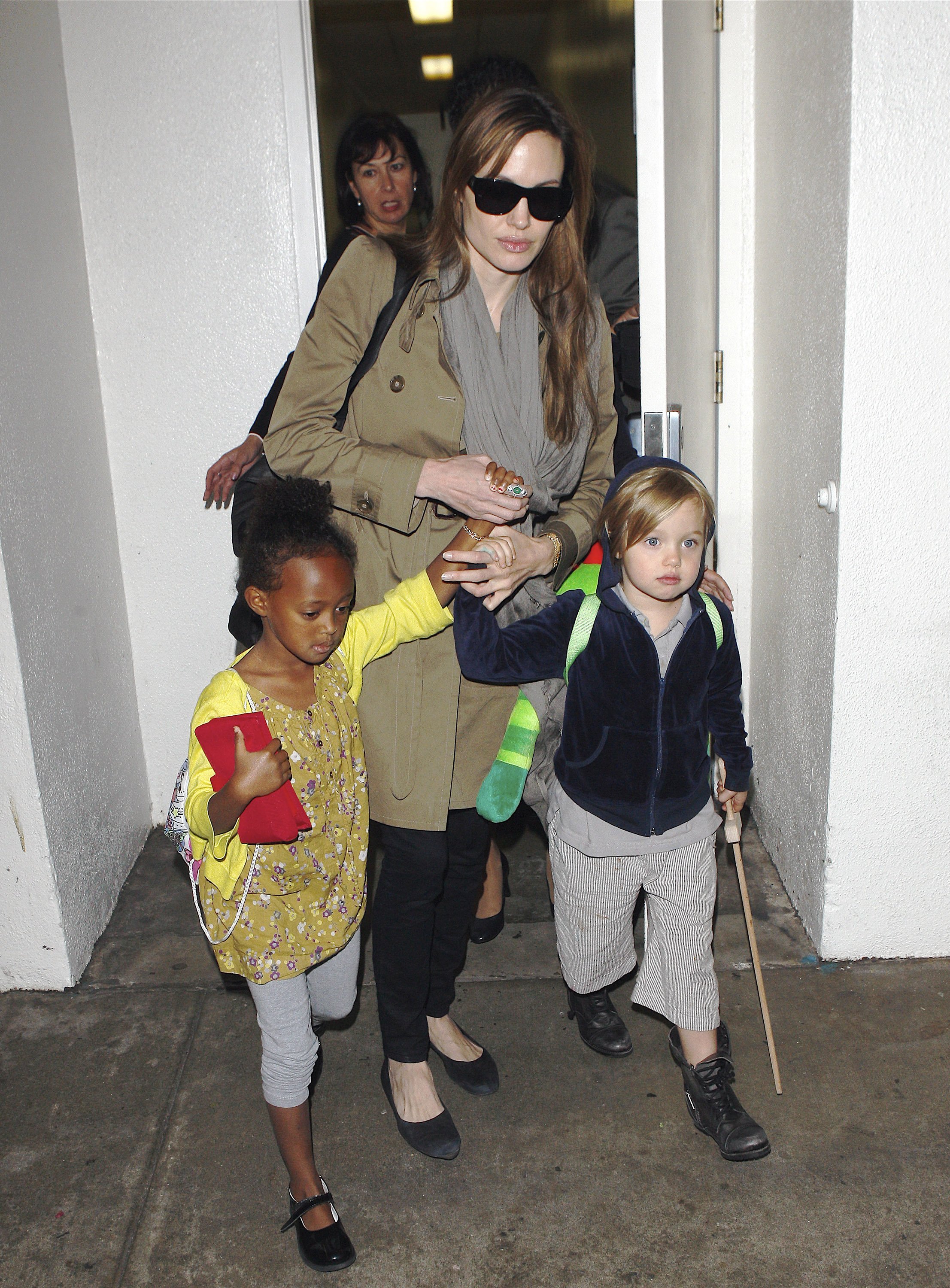 Angelina Jolie, Shiloh, and Zahara Jolie-Pitt seen at LAX Airport on September 18, 2010, in Los Angeles, California | Source: Getty Images