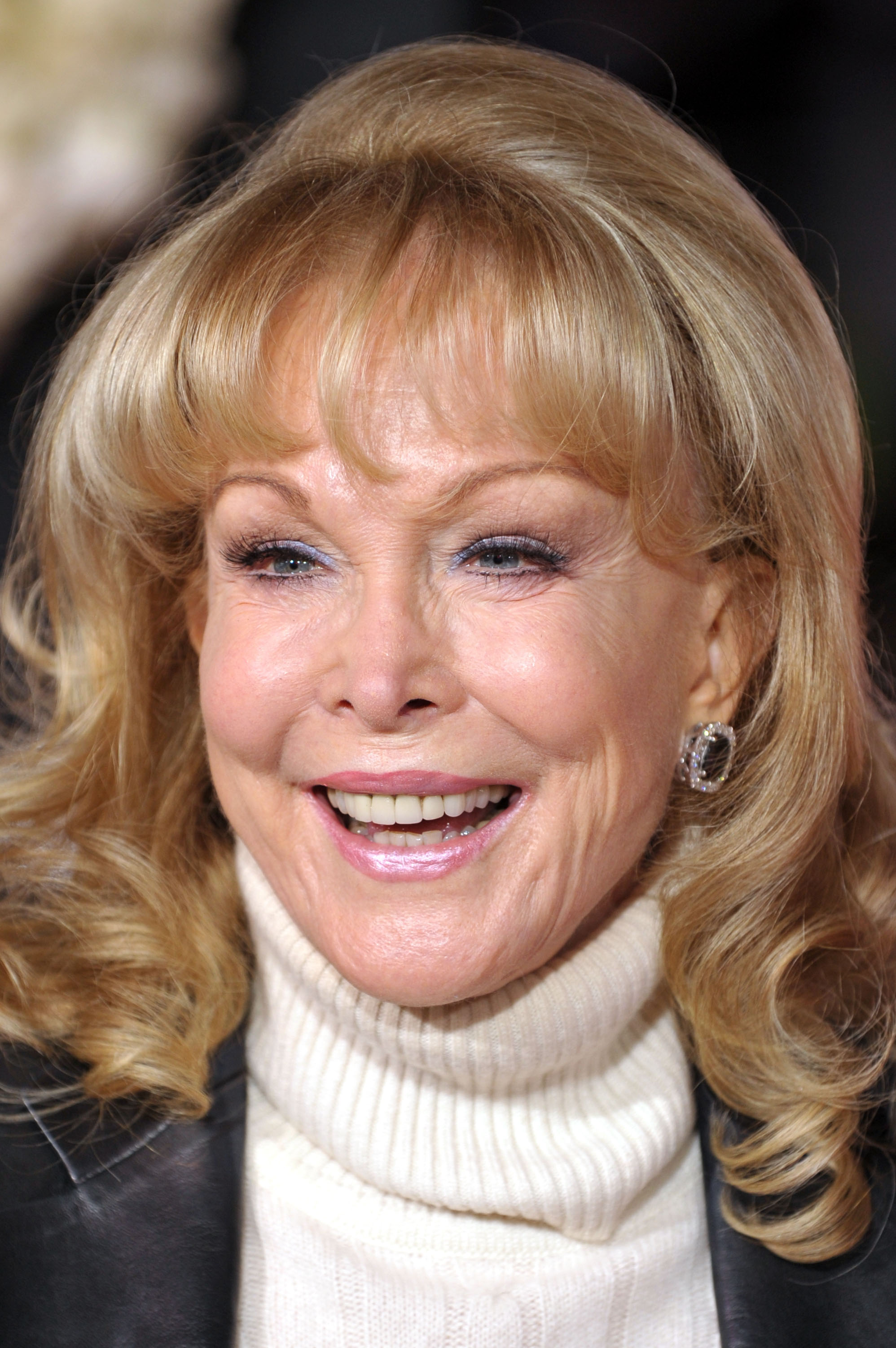 Barbara Eden smiles in a cream turtleneck and dark jacket at the "Valentine's Day" Los Angeles premiere at Grauman's Chinese Theatre.