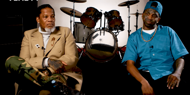 Dee Jay Daniels and DL Hughley during their interview with Vlad TV, posted on YouTube in February 2021 | Photo: YouTube/djvlad