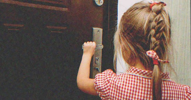 Little girl opening a door | Source: Shutterstock