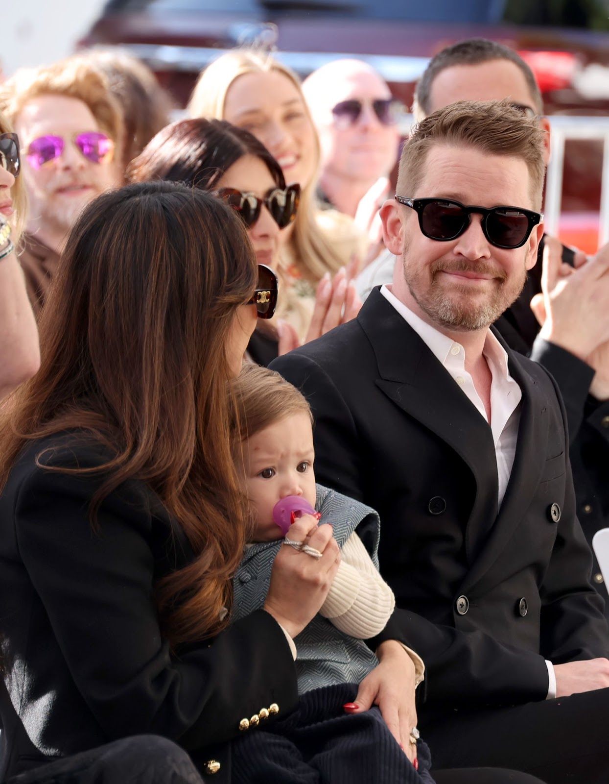 Brenda Song and Macaulay Culkin at the ceremony honoring the actor with a star on the Hollywood Walk of Fame on December 1, 2023. The couple, joined by their child, celebrated this milestone, with Song showing steadfast support for Culkin's accomplishments over the years. | Source: Getty Images