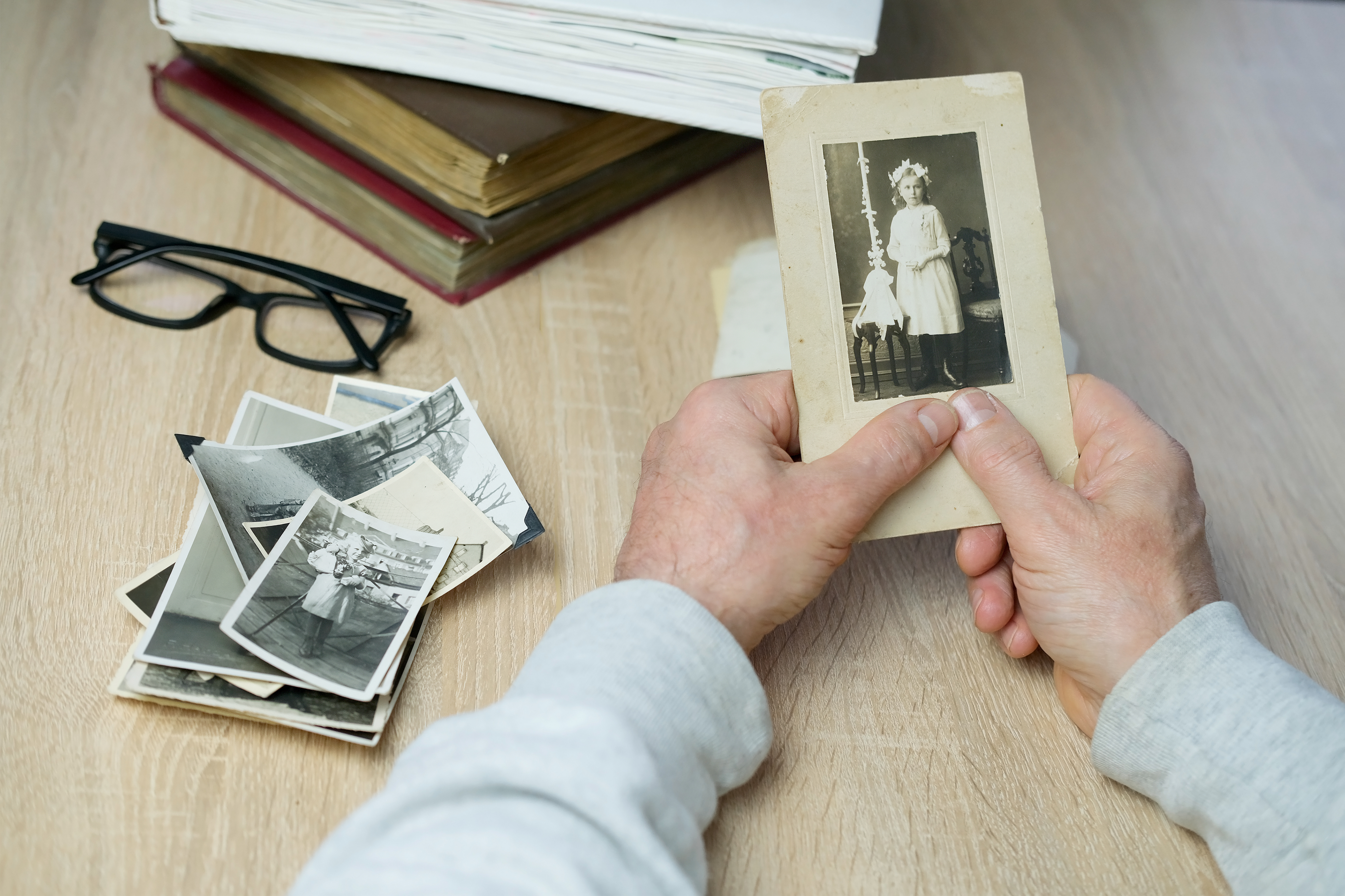 A person holding an old vintage photo | Source: Shutterstock