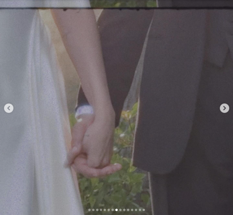 A photo of Selena Gomez and Benny Blanco holding hands on their wedding day, from a post dated September 28, 2205 | Source: Instagram/selenagomez