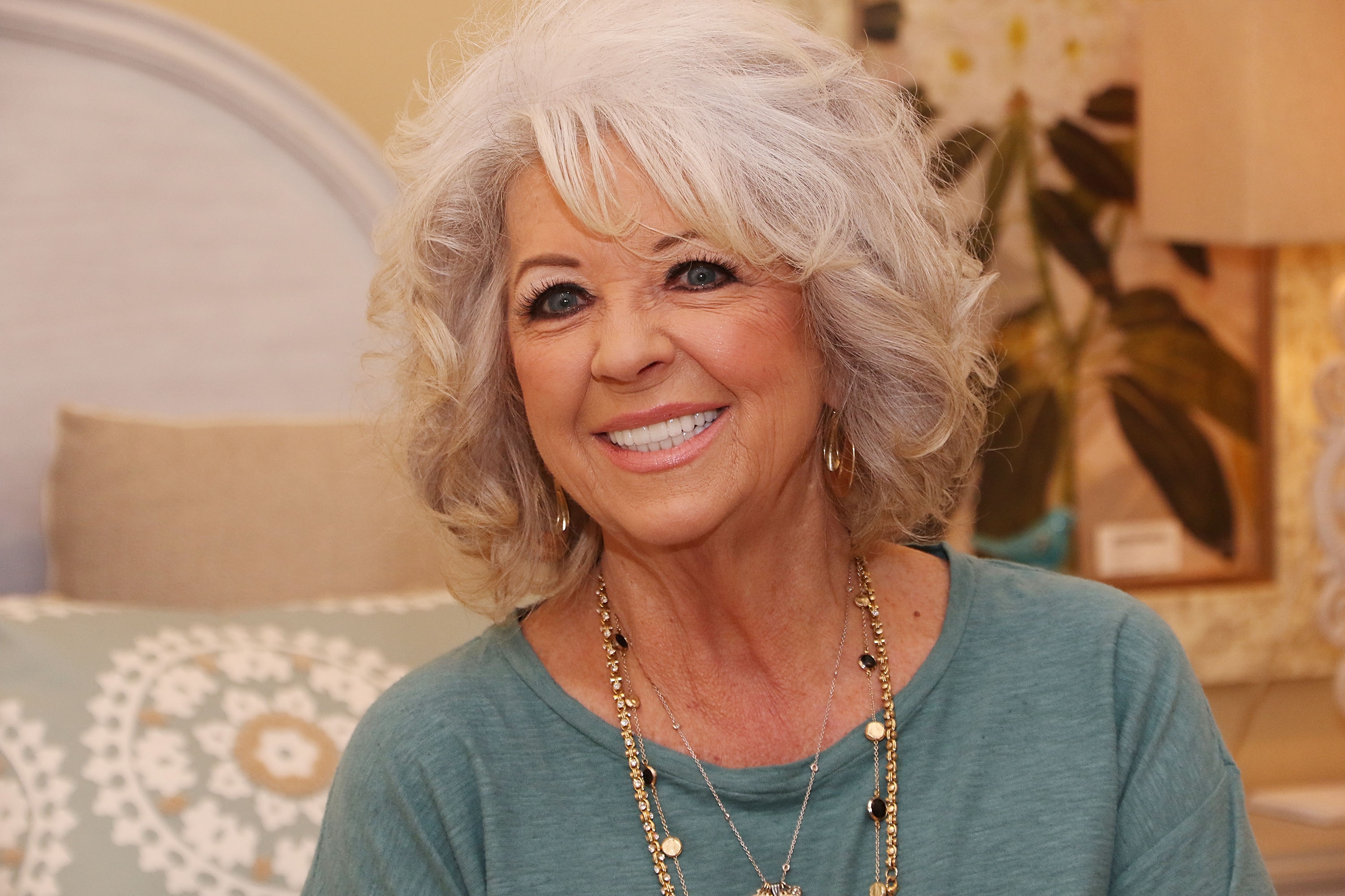 Paula Deen signs copies of her book during Cuts the Fat Book Tour on January 30, 2016. | Source: Getty Images