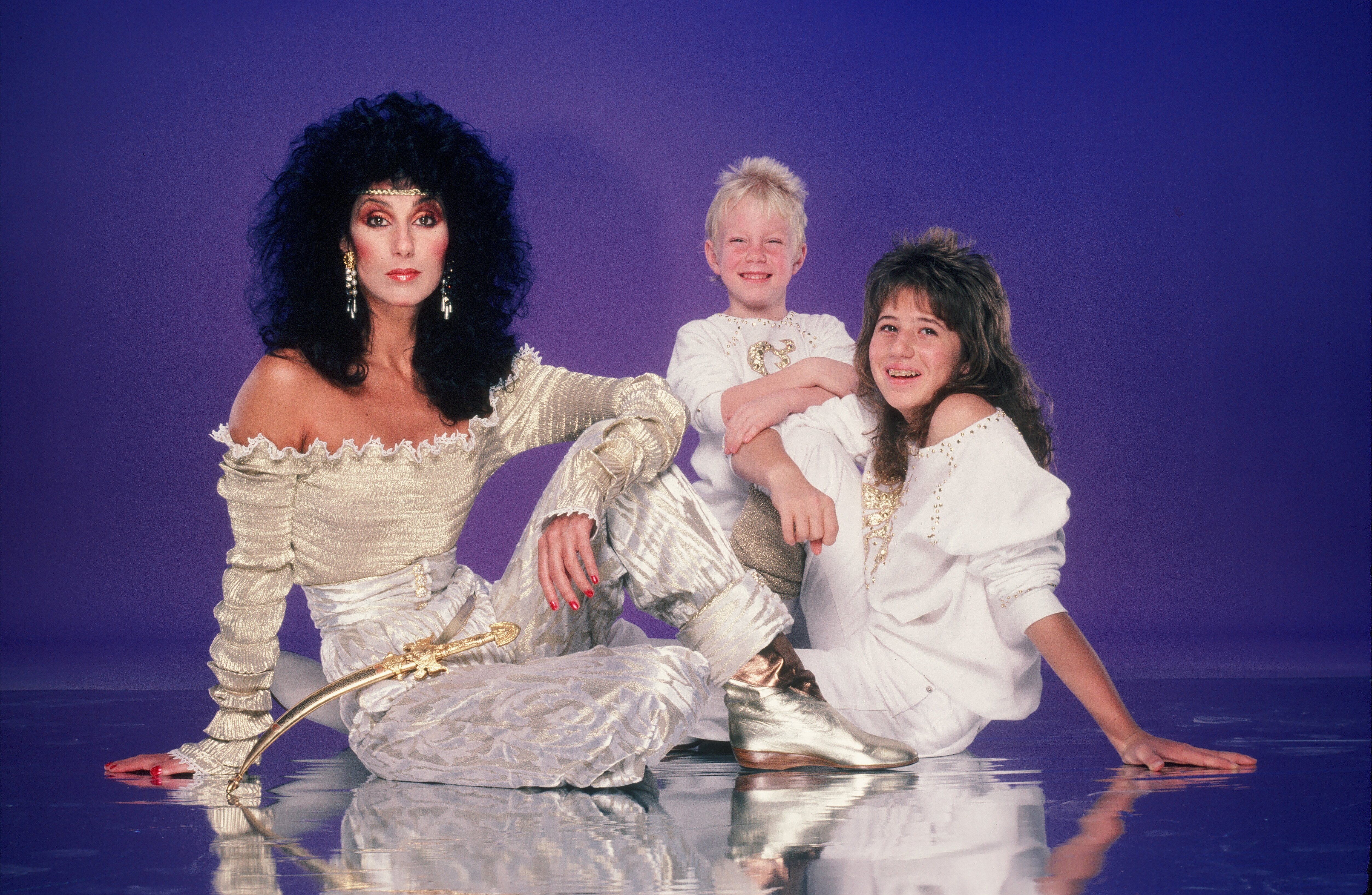 Cher, Chastity (Chaz) Bono, and Elijah Blue Allman in a photo session in June 1981 | Source: Getty Images