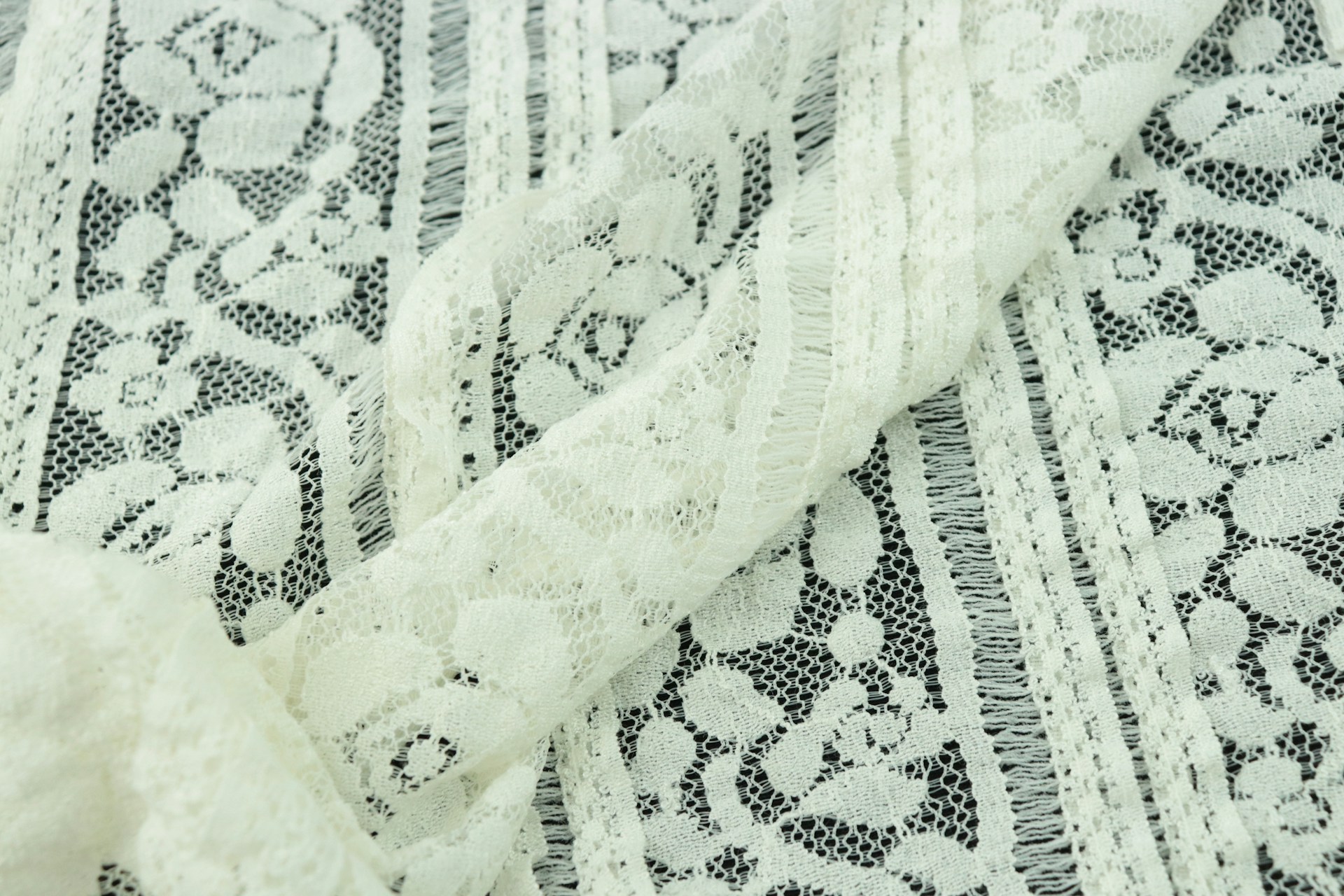 Close-up shot of lace fabric | Source: Unsplash