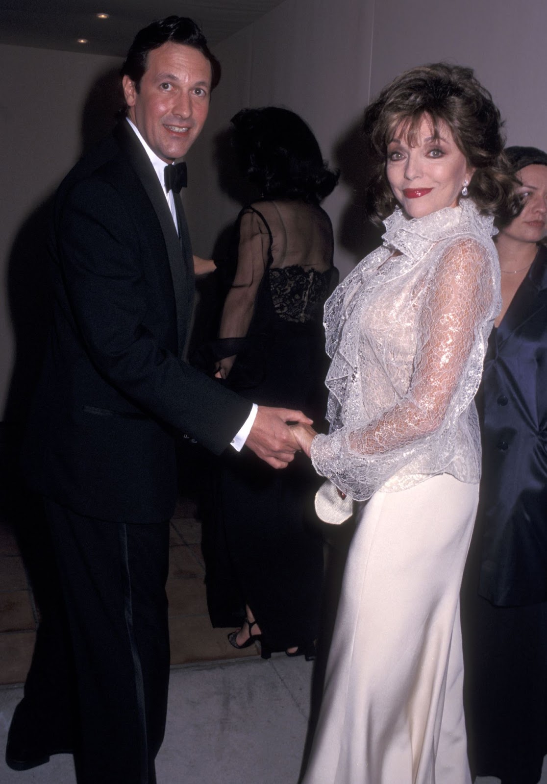 Percy Gibson and Joan Collins at the Ninth Annual Vanity Fair Oscar Party on March 24, 2002, in West Hollywood, California. | Source: Getty Images