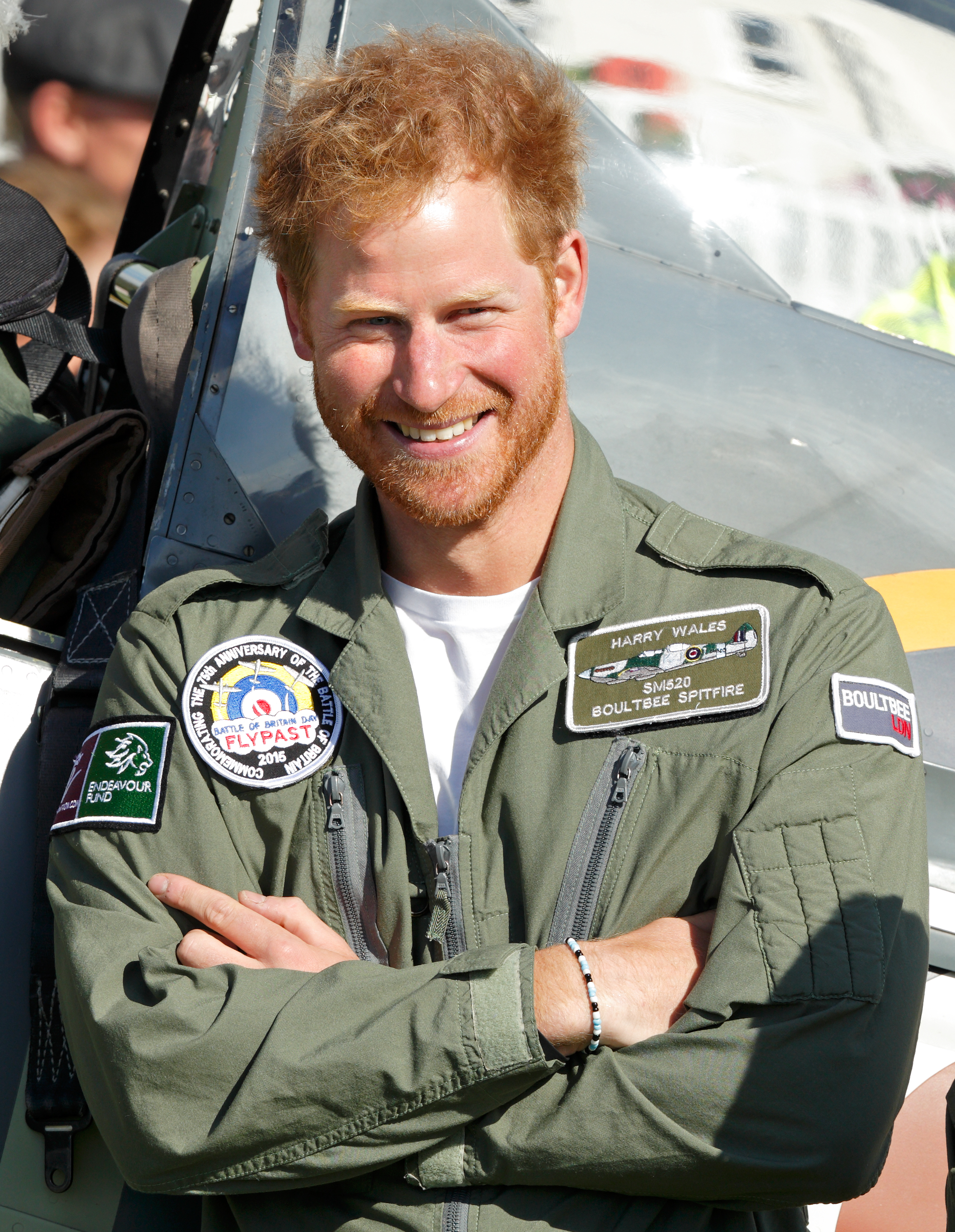 Prince Harry stands near a Spitfire Aircraft at Goodwood Aerodrome on September 15, 2015 in Chichester, England. | Source: Getty Images
