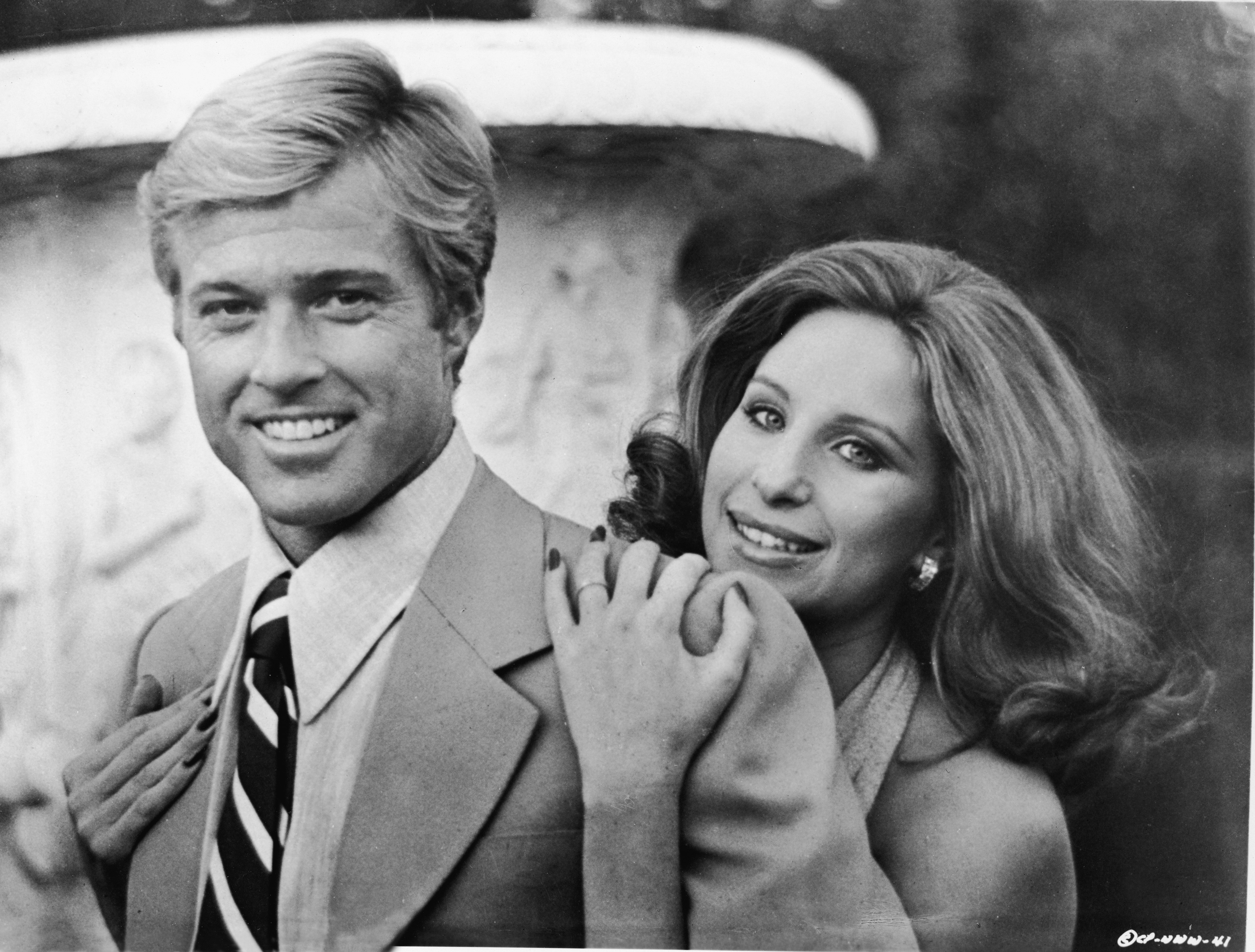 Barbra Streisand hugging Robert Redford in a still from their movie, "The Way We Were," in 1973. | Source: Getty Images