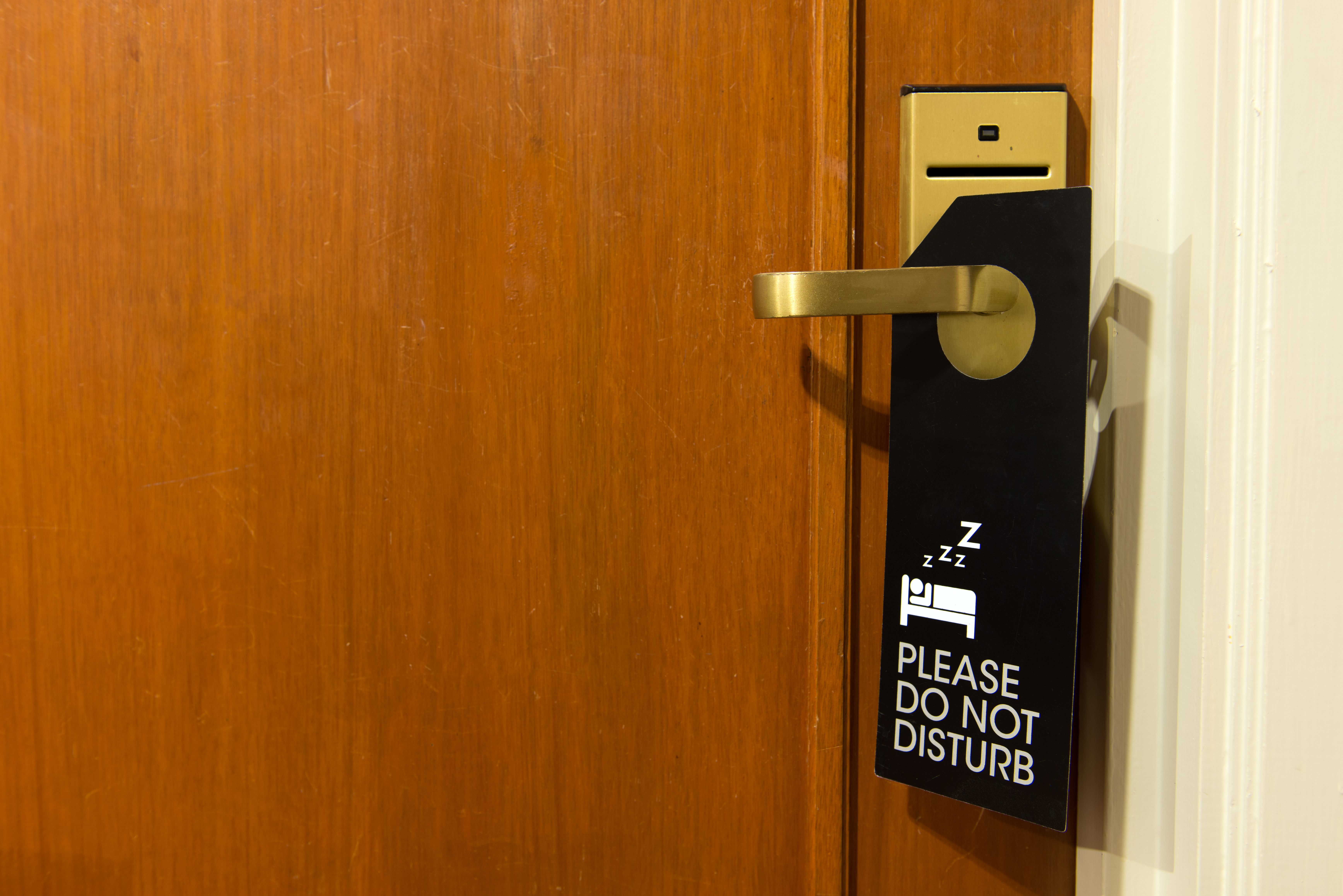 A "do not disturb" sign on a doorknob | Source: Shutterstock