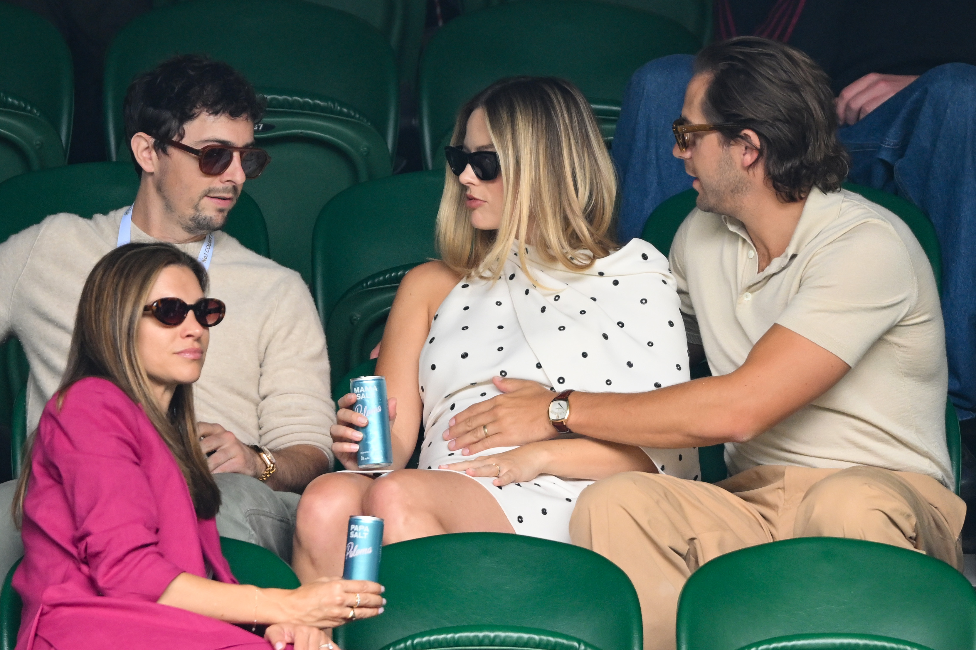 Josey McNamara, Margot Robbie and Tom Ackerley at the All England Lawn Tennis and Croquet Club on July 12, 2024, in London, England. | Source: Getty Images