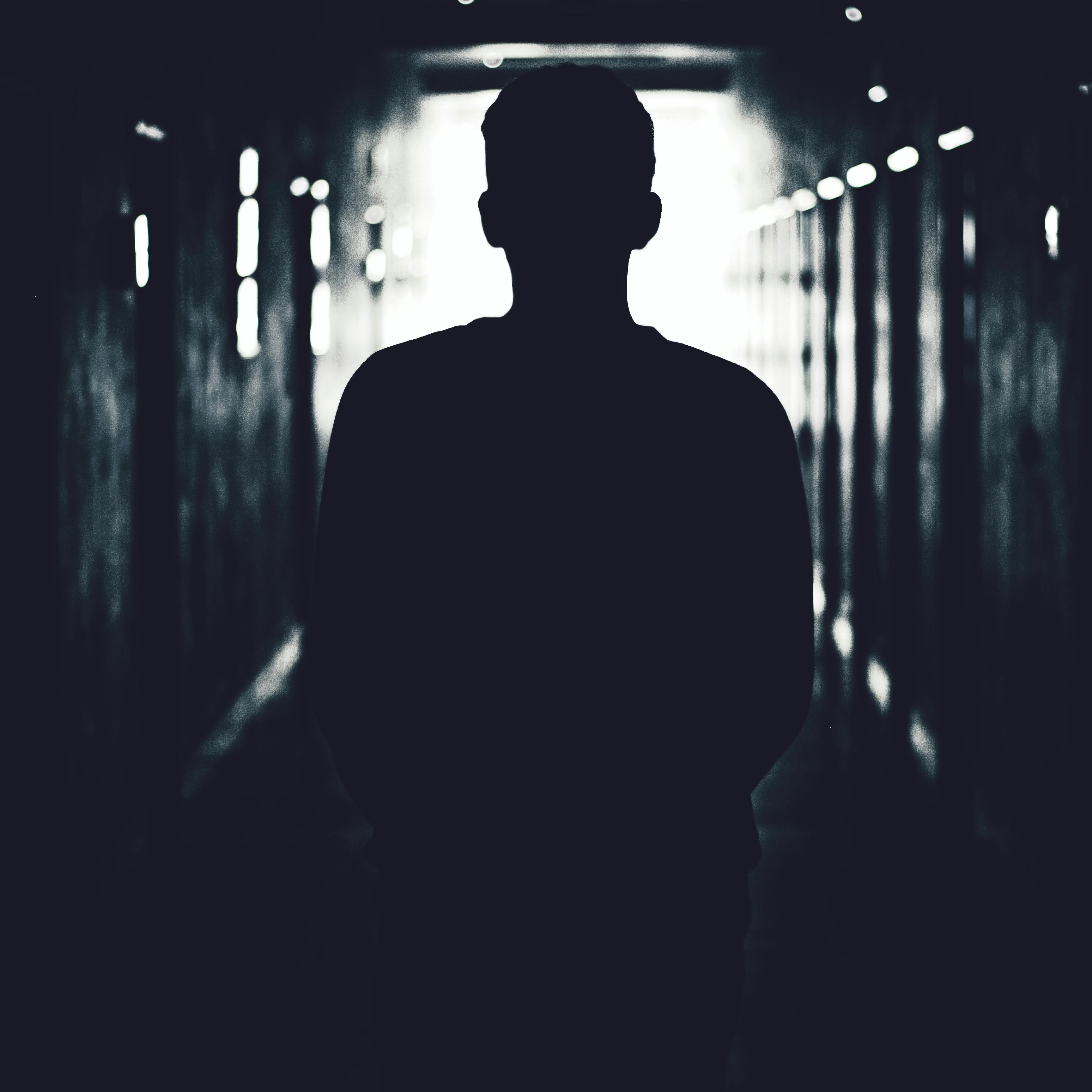 Silhouette of a person on a corridor | Source: Pexels