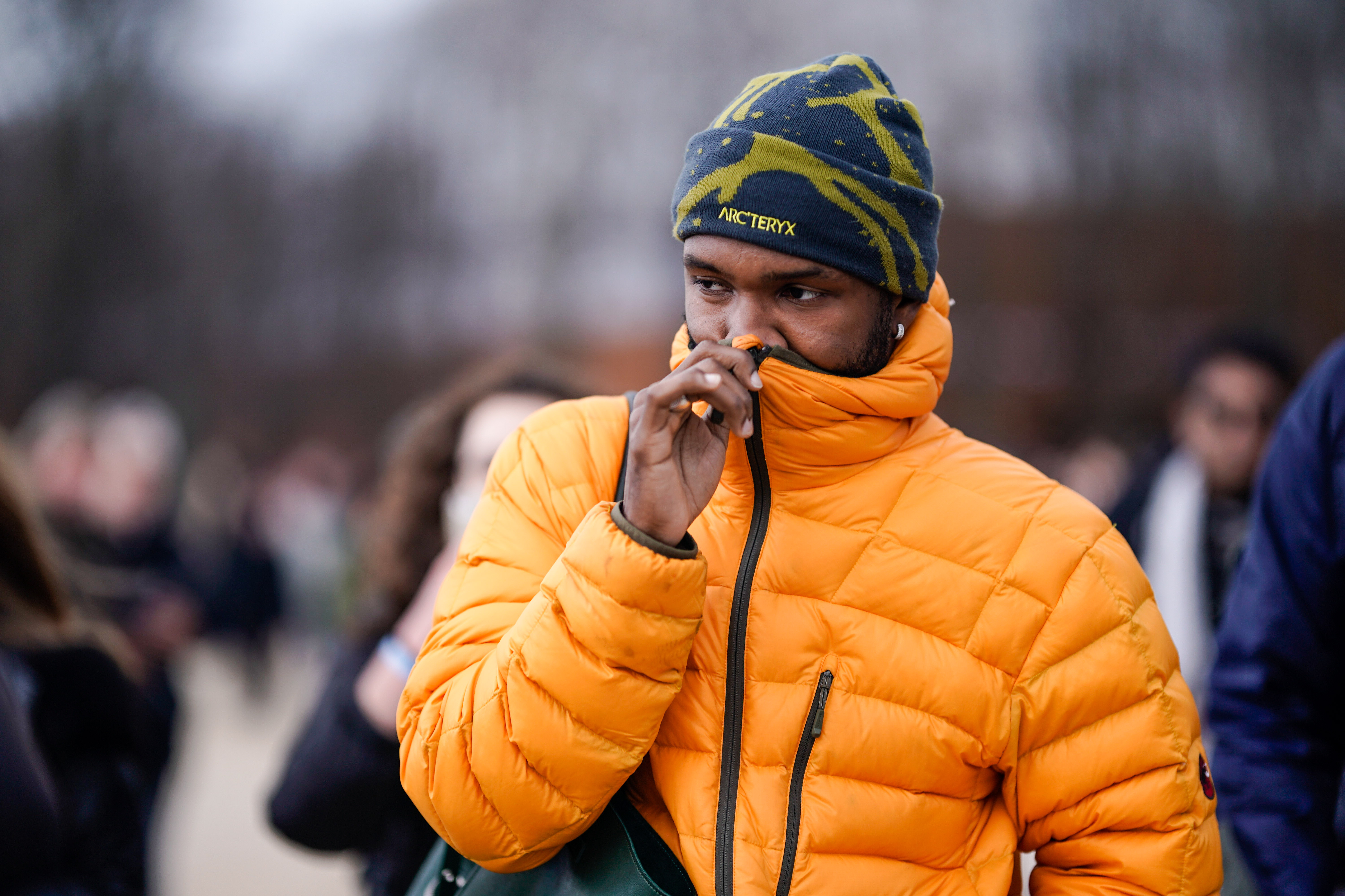 Frank Ocean pictured wearing an orange puffer jacket, a beanie hat during Paris Fashion Week - Menswear F/W 2019-2020, on January 17, 2019 in Paris, France  | Source: Getty Images
